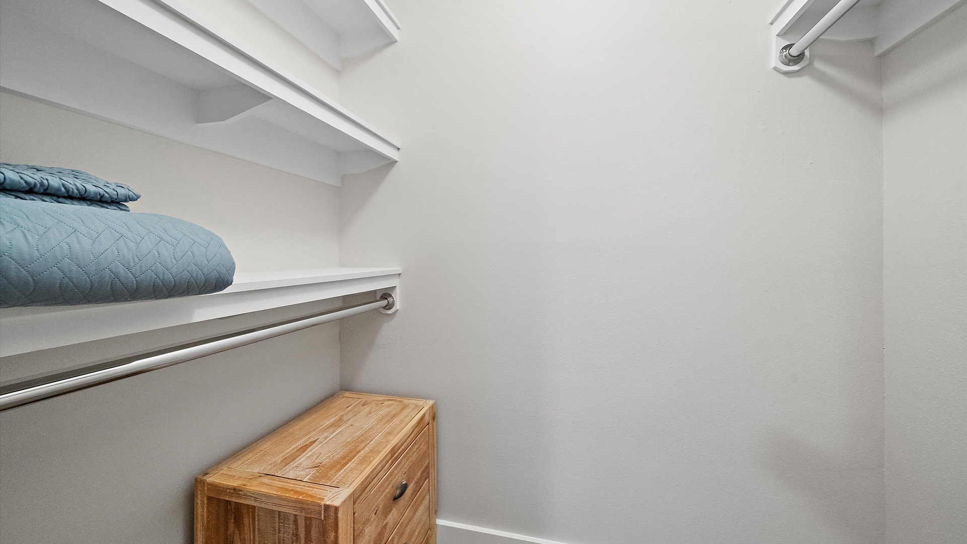 Your spacious walk-in closet provides ample storage with built-in shelving and hanging rods for all your belongings.