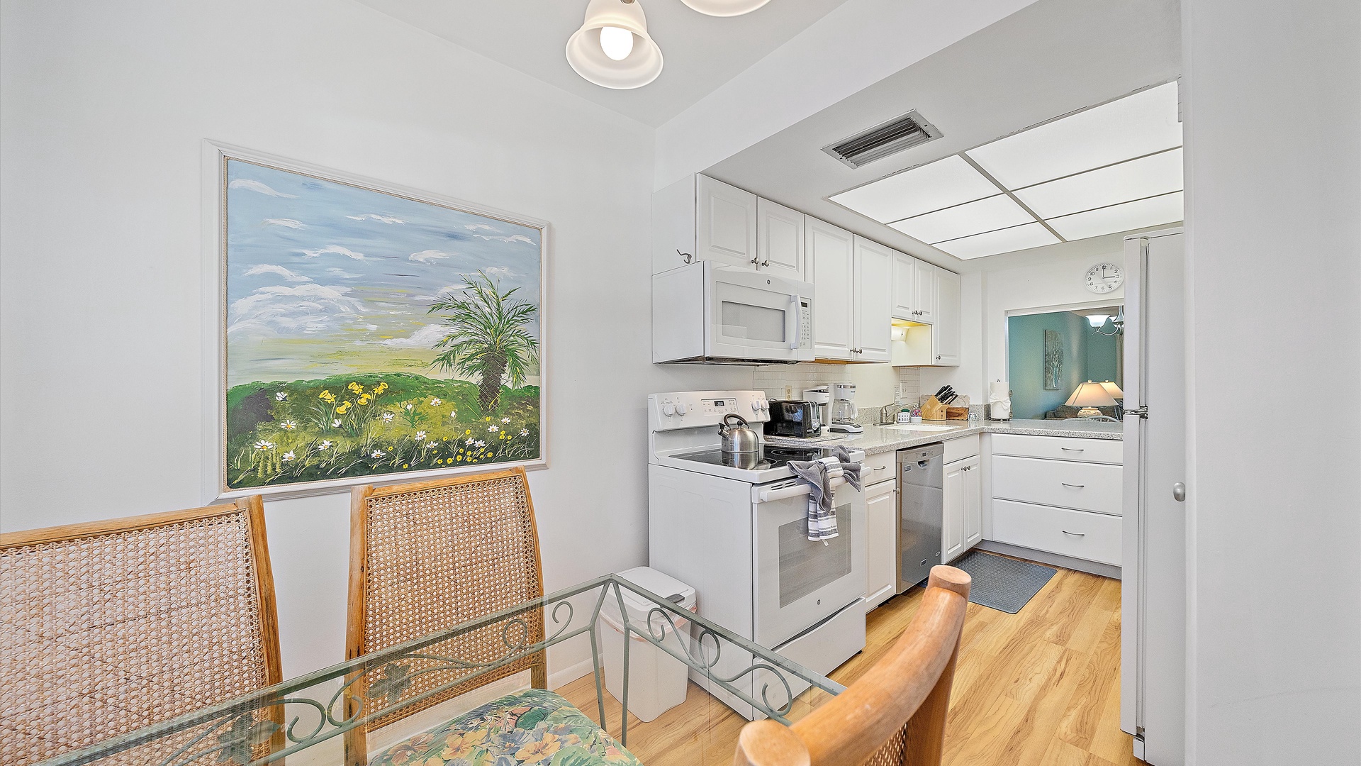 Whip up your favorite meals in this bright, fully equipped kitchen featuring modern appliances, ample counter space, and coastal-inspired décor that makes cooking feel like a breeze.