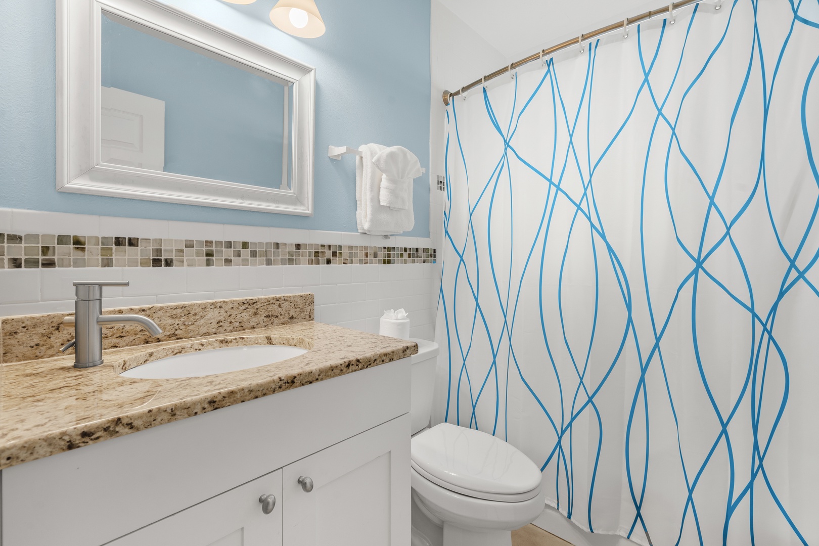 Your private bathroom features granite countertops, shower tub combo, plush bath towels, and starter essentials for your stay.