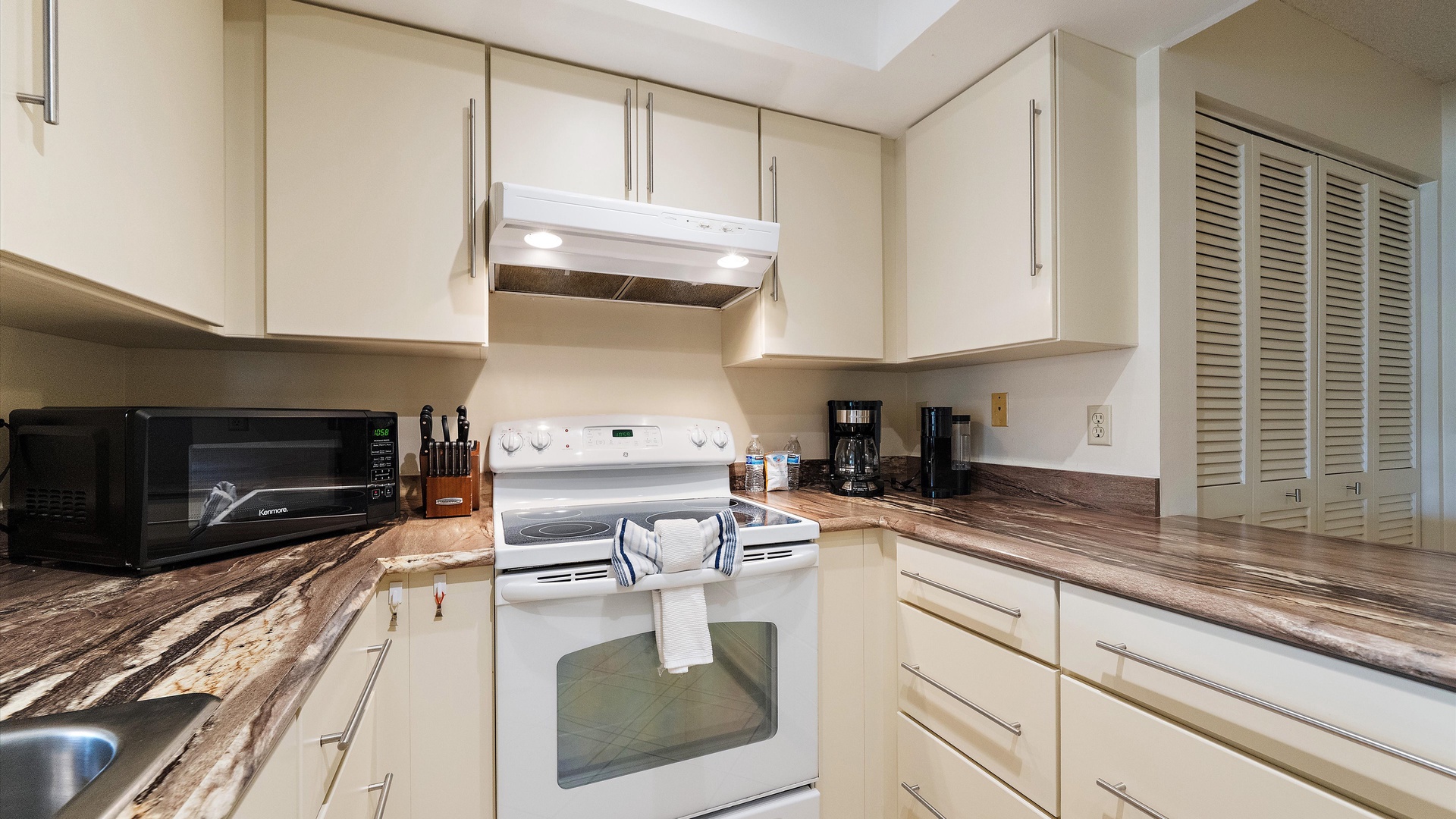 Your fully equipped kitchen awaits, featuring modern appliances and generous counter space where you can whip up meals with ease during your stay.