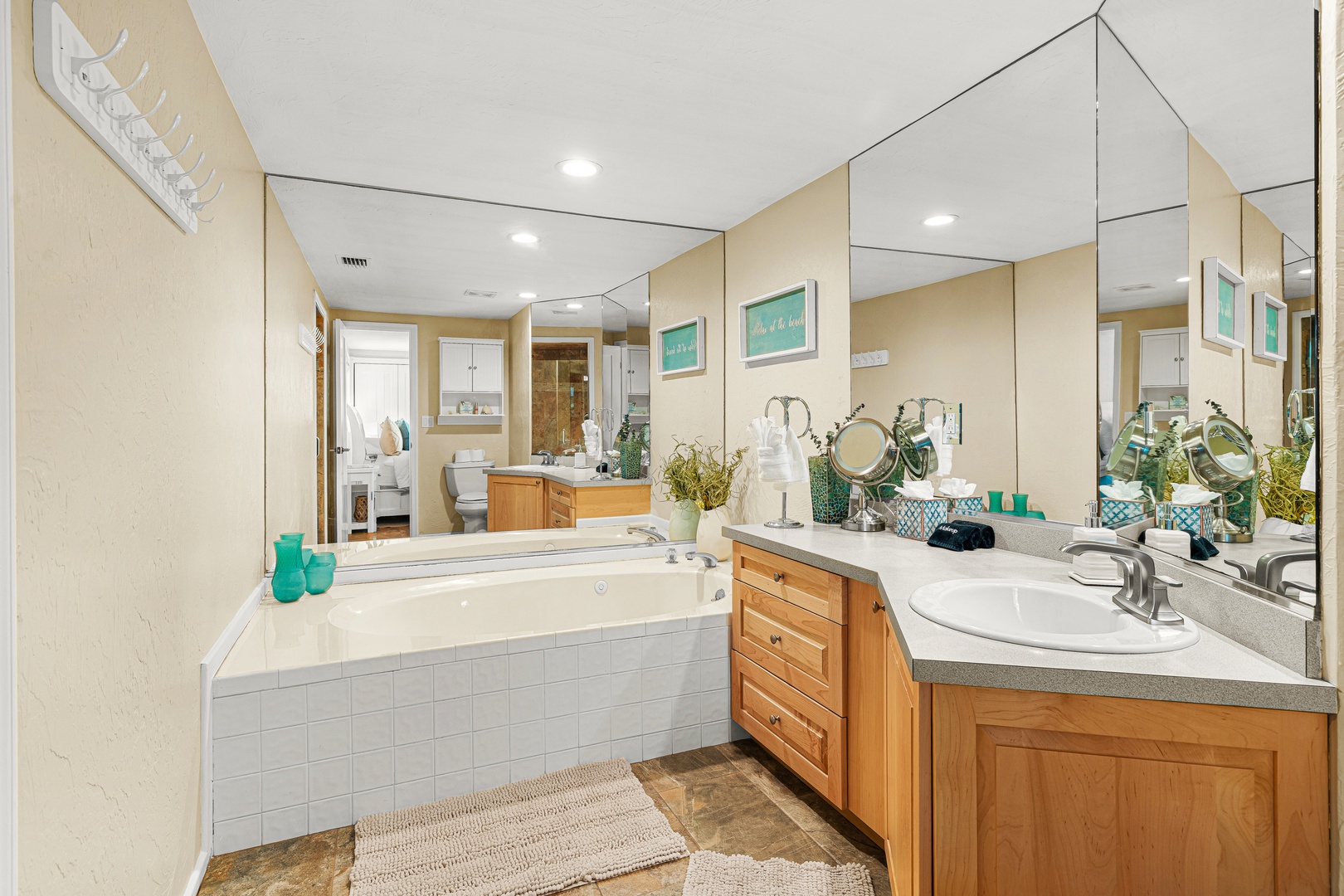 Refresh and unwind in your spacious private bathroom, complete with a soaking tub, dual vanities, and thoughtful coastal touches that set the tone for a relaxing stay.