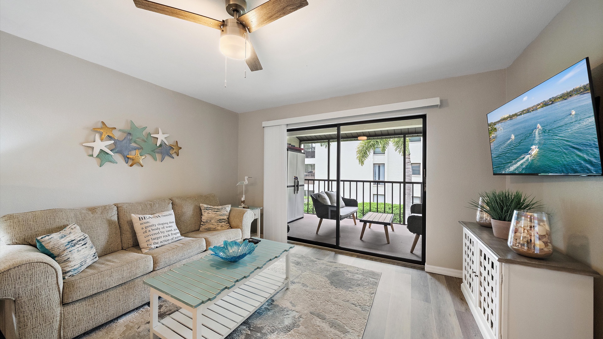 Kick back on the comfy sofa and enjoy coastal vibes with charming beach-themed décor. Step through the glass door to your private balcony and take in the refreshing views.