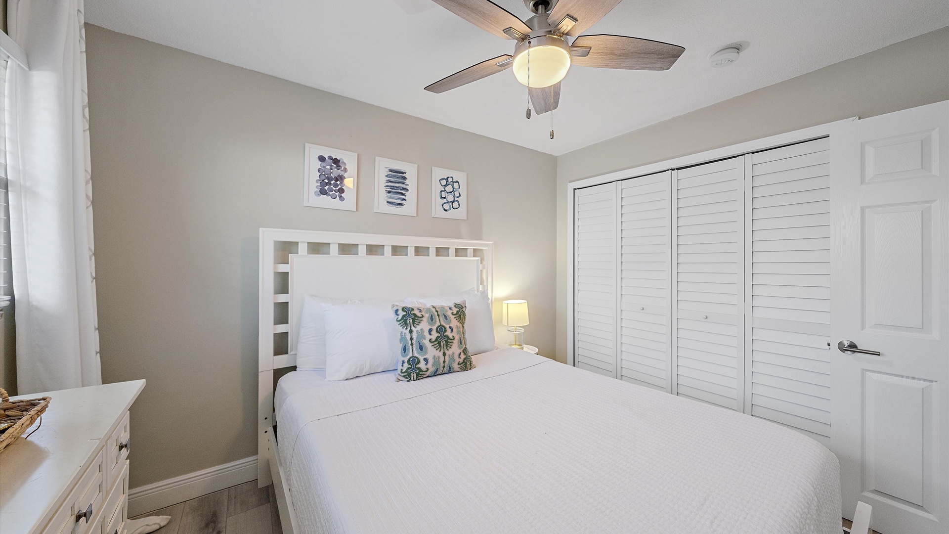 Slip into fresh linens under the soft glow of your bedside lamp. The ceiling fan keeps you comfortable, while generous closet space means you can truly settle in.