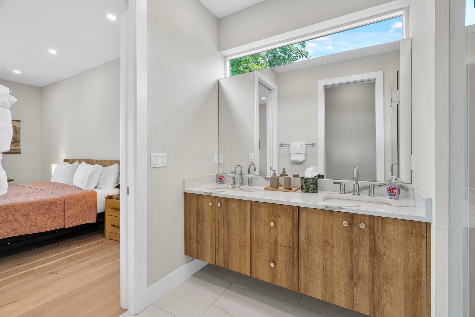 Step into your spa-like ensuite bathroom, where natural light floods in from above and the dual vanity gives you plenty of space to refresh and get ready for your day.