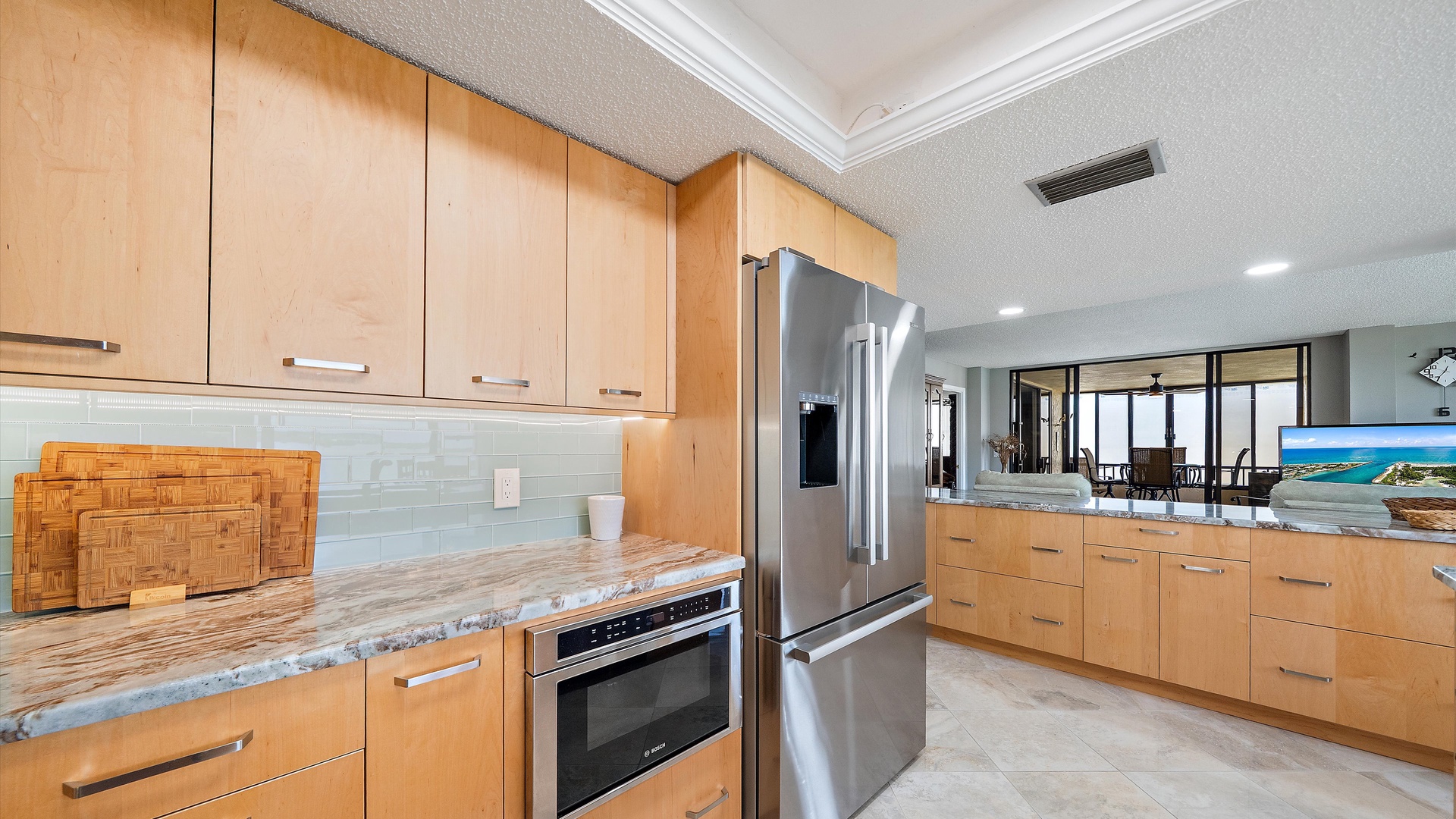Your gourmet kitchen awaits with granite counters, stainless steel appliances, and sleek wood cabinets—perfect for preparing memorable vacation meals.