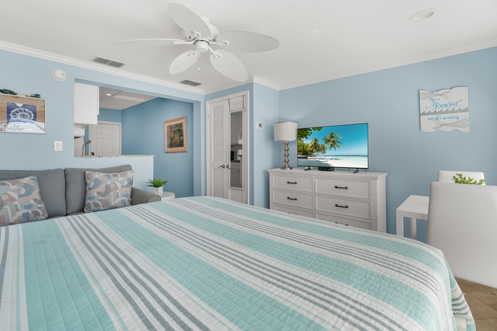 Drift off to sleep in your peaceful coastal retreat, surrounded by soothing ocean blues and tropical views on the TV.