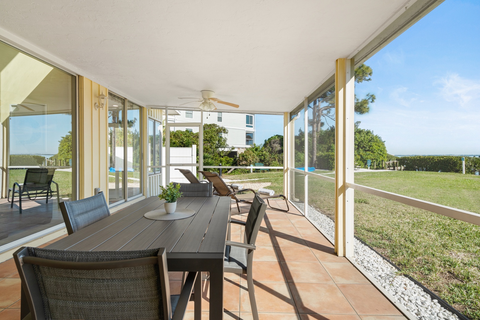 Your screened porch offers comfortable dining with waterfront views, perfect for peaceful mornings or evening meals surrounded by nature.