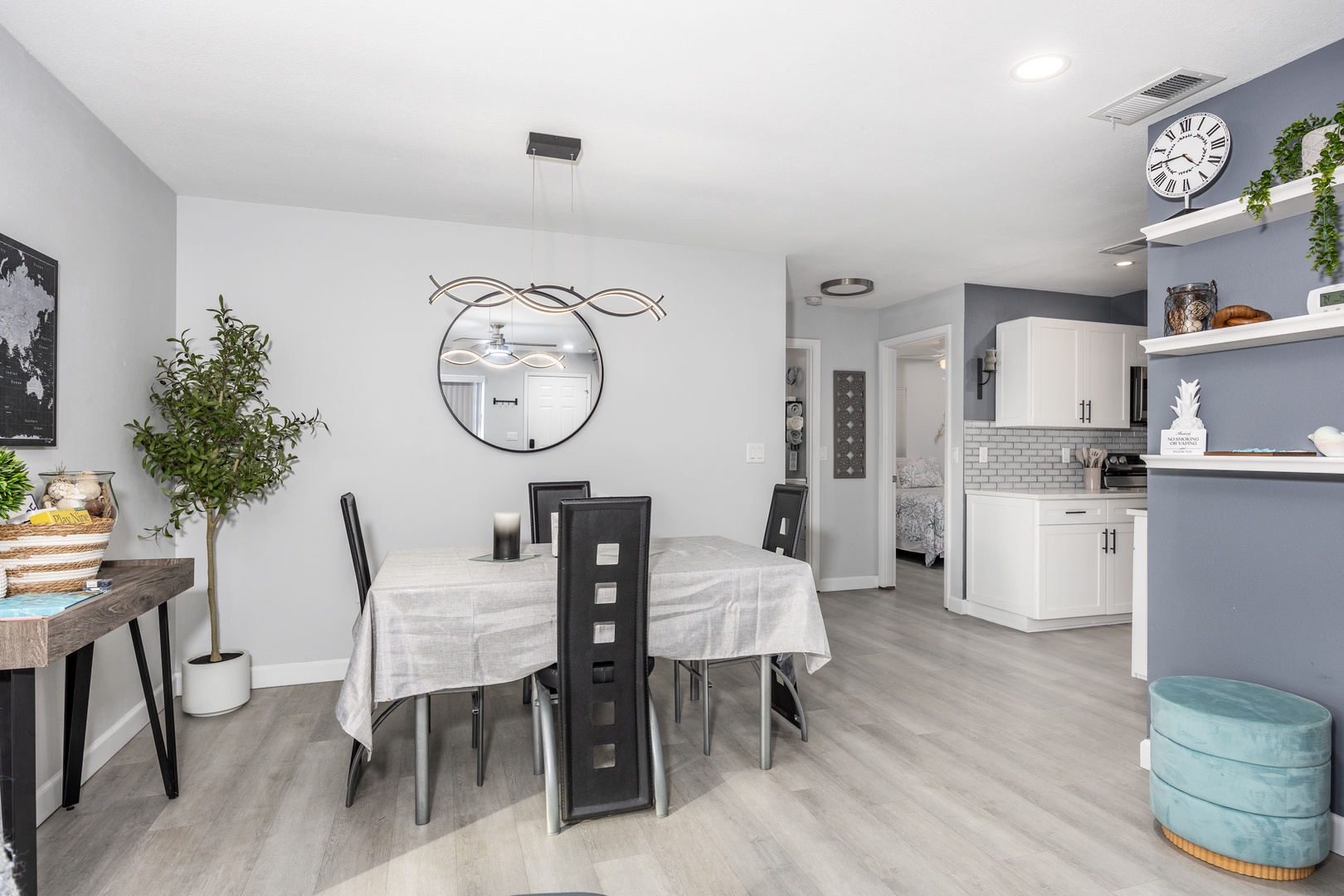 Your modern open-plan space blends kitchen and dining seamlessly, with stylish furnishings and thoughtful touches creating a perfect gathering spot.
