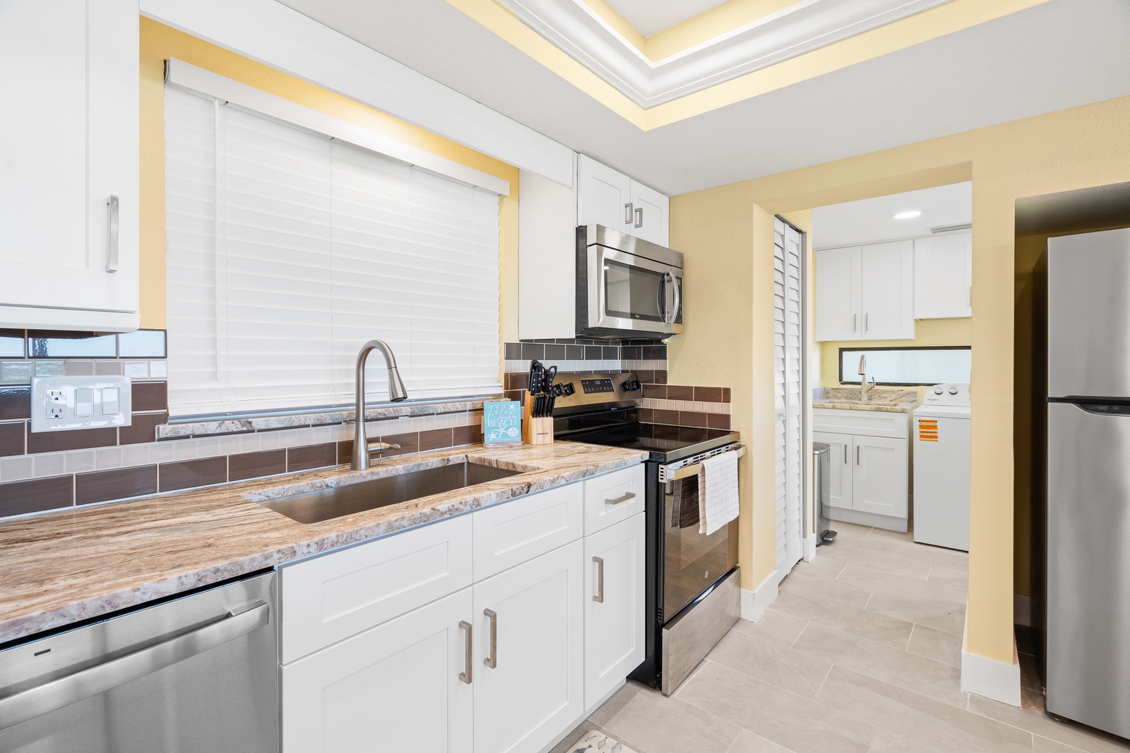 Your fully equipped kitchen features granite counters, stainless appliances, and everything needed to create memorable meals during your stay.