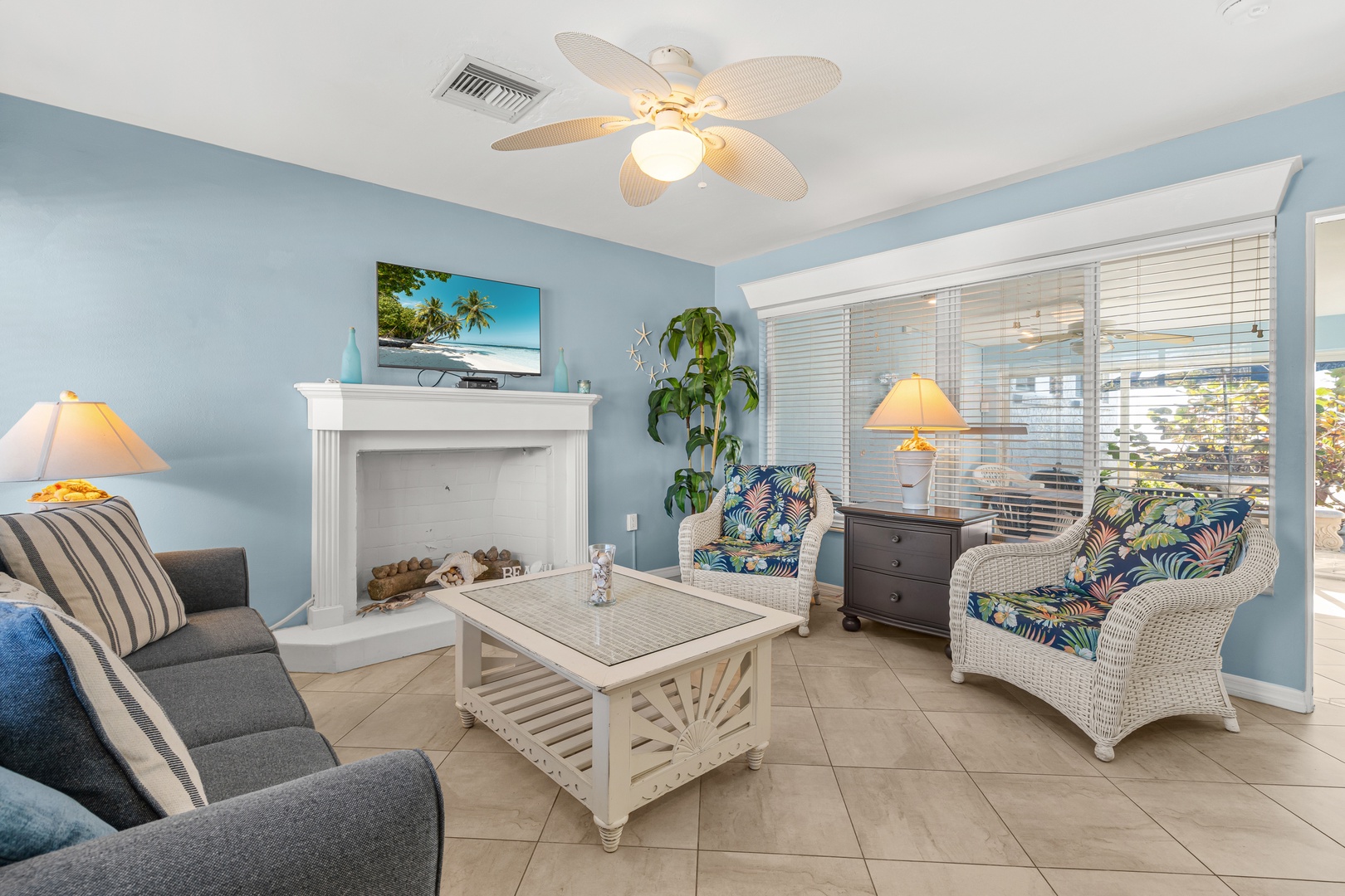 Cozy seating, patio access, and beach views from the main living space.