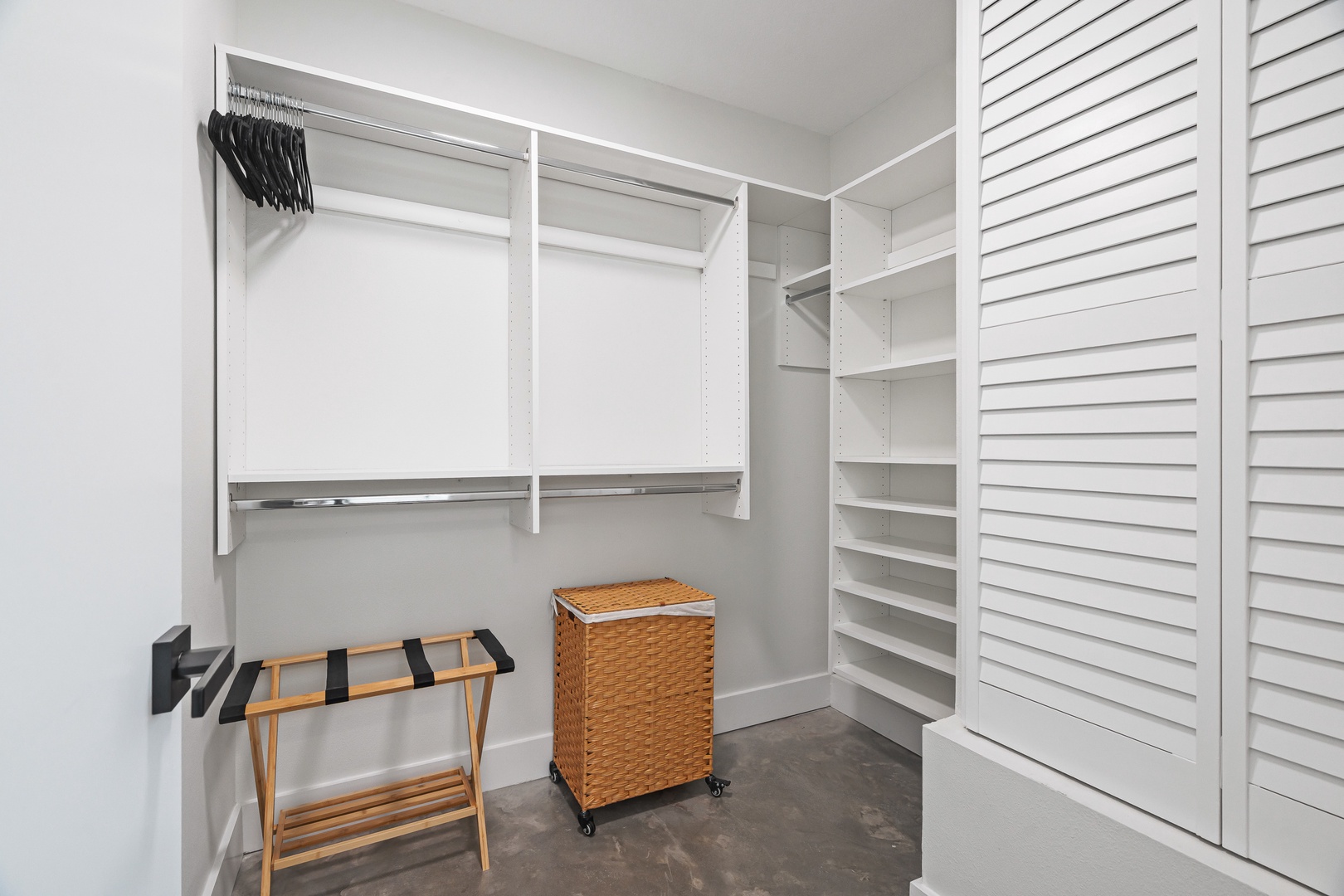 Your spacious walk-in closet features custom shelving, hanging rods, and ample storage to keep your belongings perfectly organized throughout your stay.