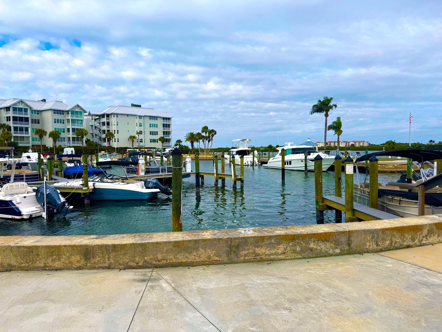Charming marina with luxury yachts and waterfront condominiums creates a picturesque coastal setting for your vacation getaway.
