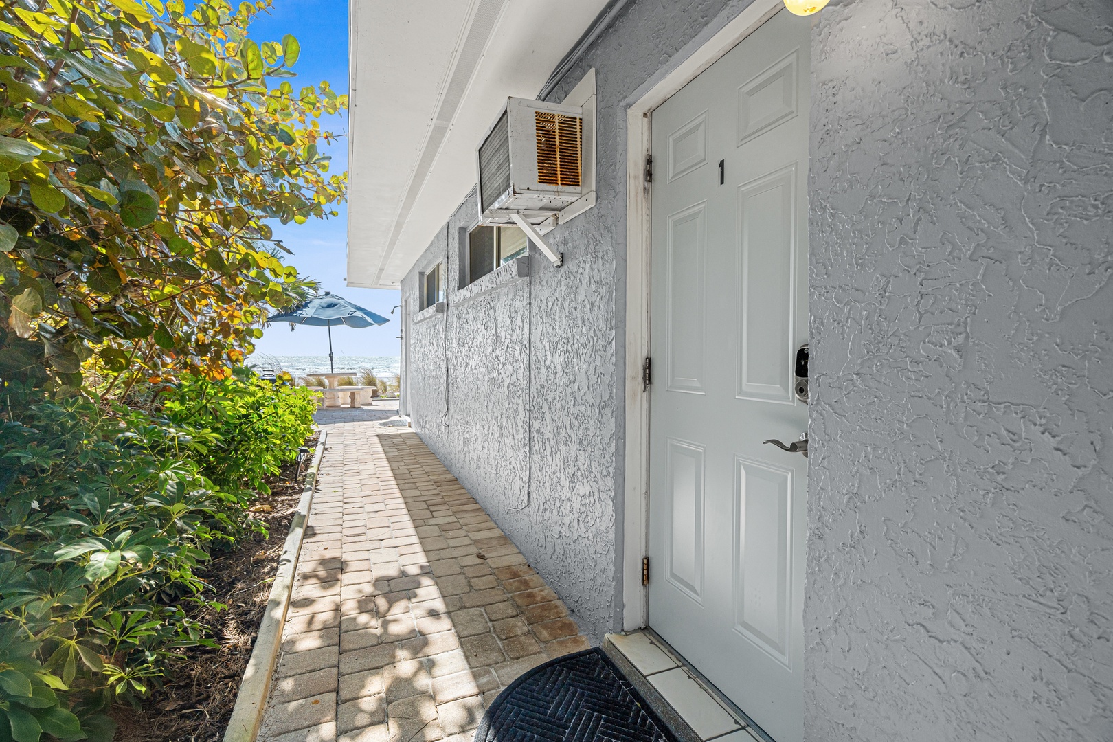 Las Hermanas Unit 1 entrance down the private walkway leading to the beach.