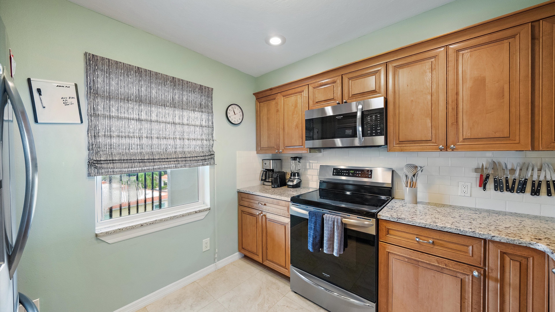 Espresso, drip coffee, and a kitchen equipped for more than breakfast. Stainless steel cooking appliances and generous granite counters make this a practical, welcoming space for an extended stay.