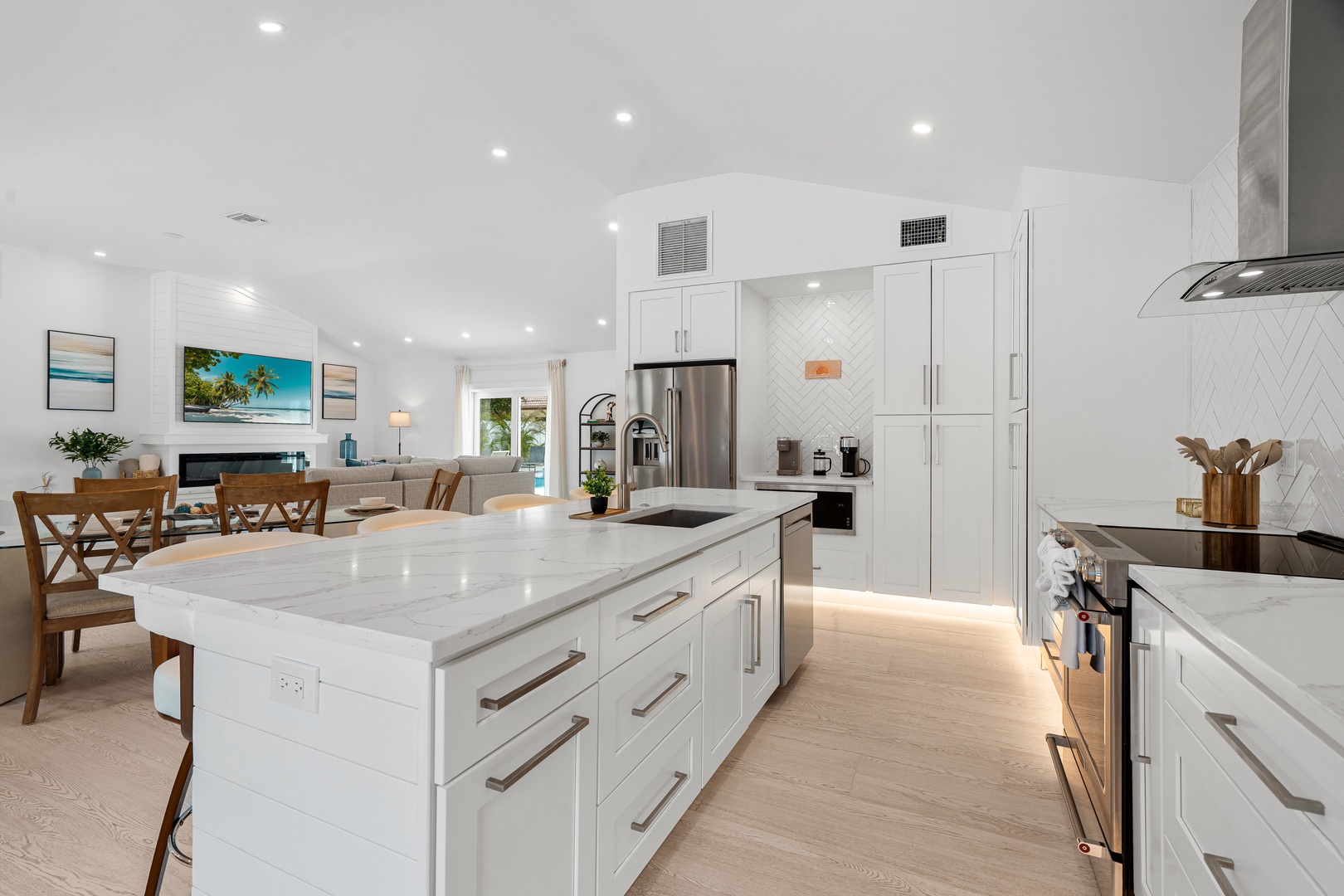 Step into your chef-ready kitchen with gleaming marble countertops, stainless appliances, and bright open space flowing into the living area—perfect for cooking and gathering.