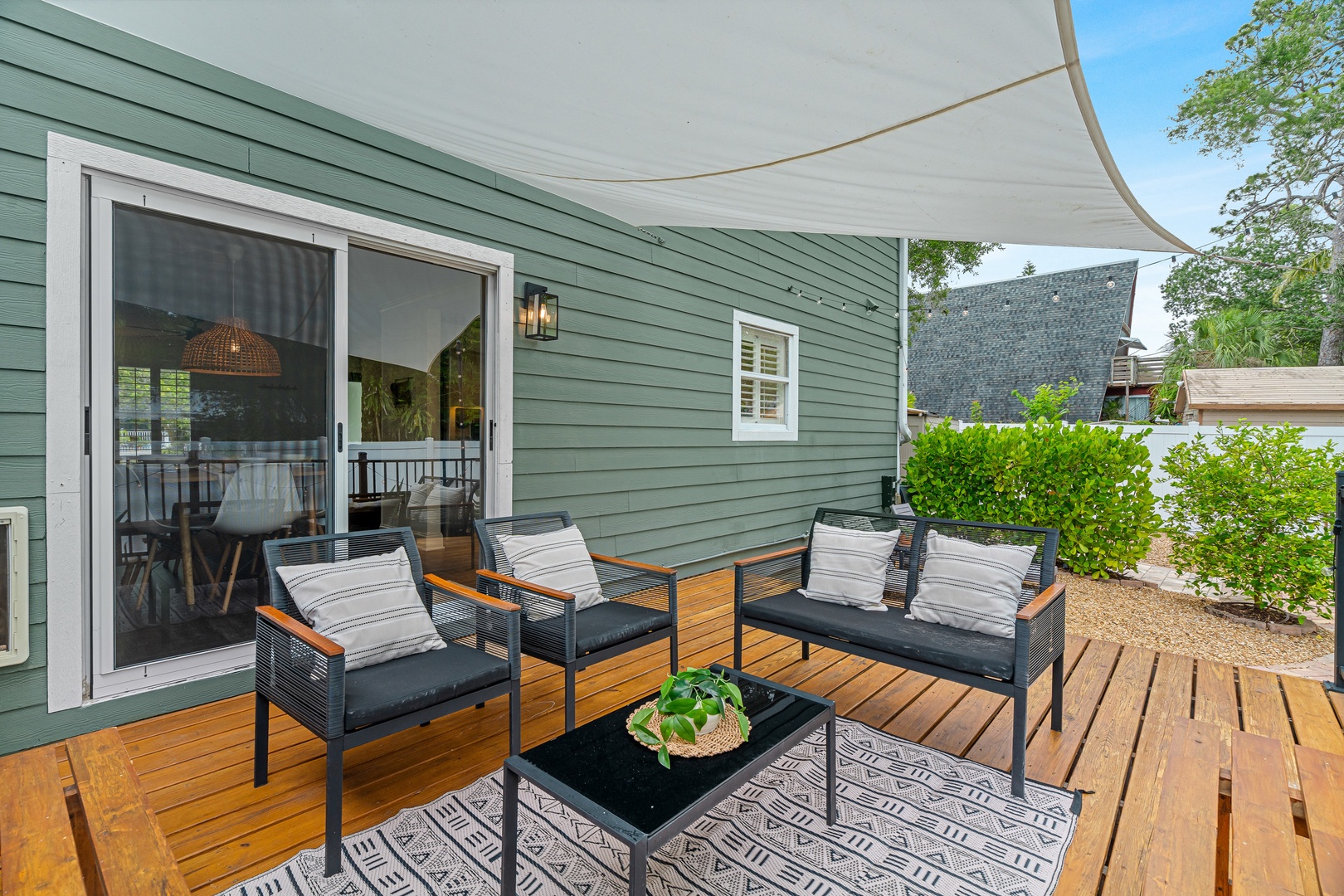 Unwind on your private deck with comfy seating and shade, perfect for morning coffee or evening relaxation surrounded by lush greenery.