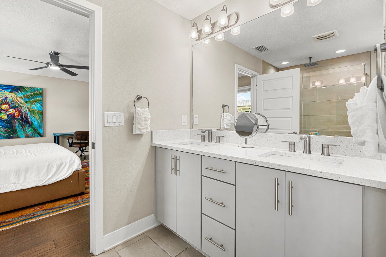 Your private bathroom offers dual sinks with ample counter space, bright lighting, and fresh linens—making it easy to refresh and start your day feeling great.
