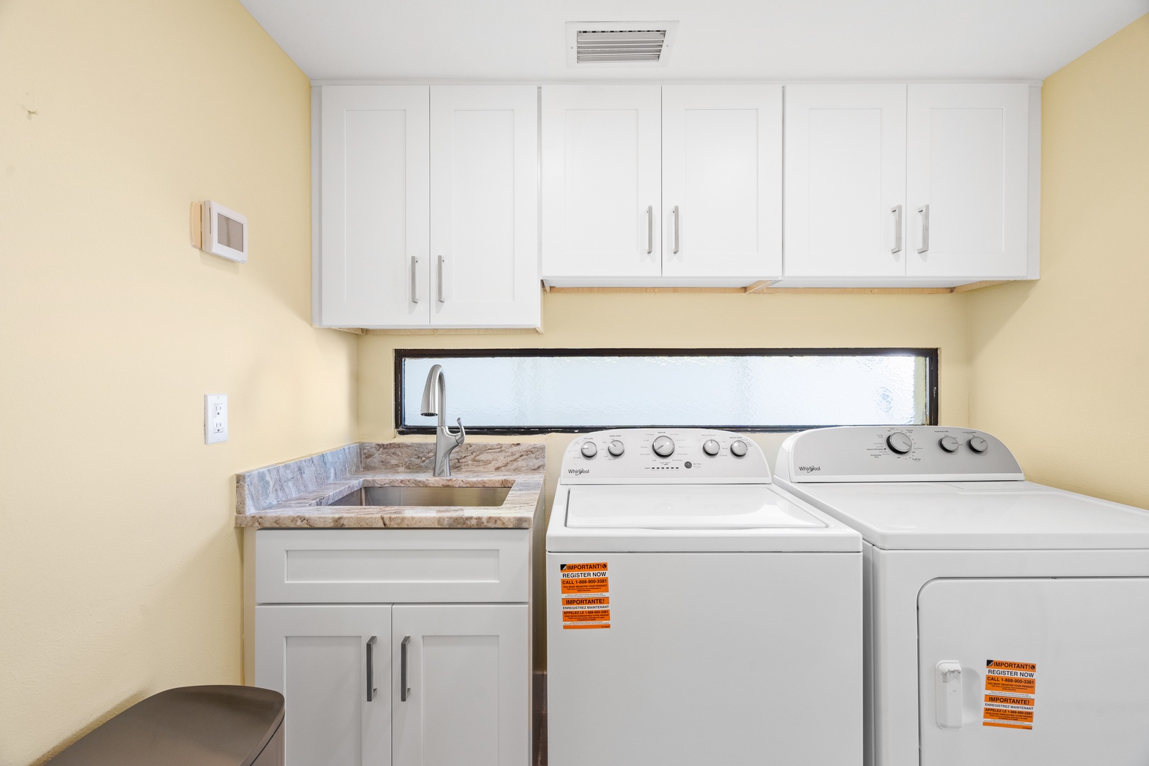 Your dedicated laundry room makes extended stays effortless with full-size washer, dryer, and convenient utility sink.