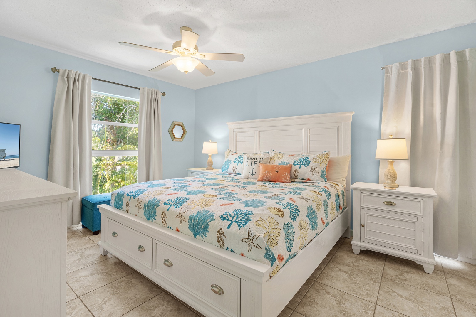 Primary bedroom featuring King bed, hotel-style linens, Smart TV with streaming services, and ensuite bathroom.