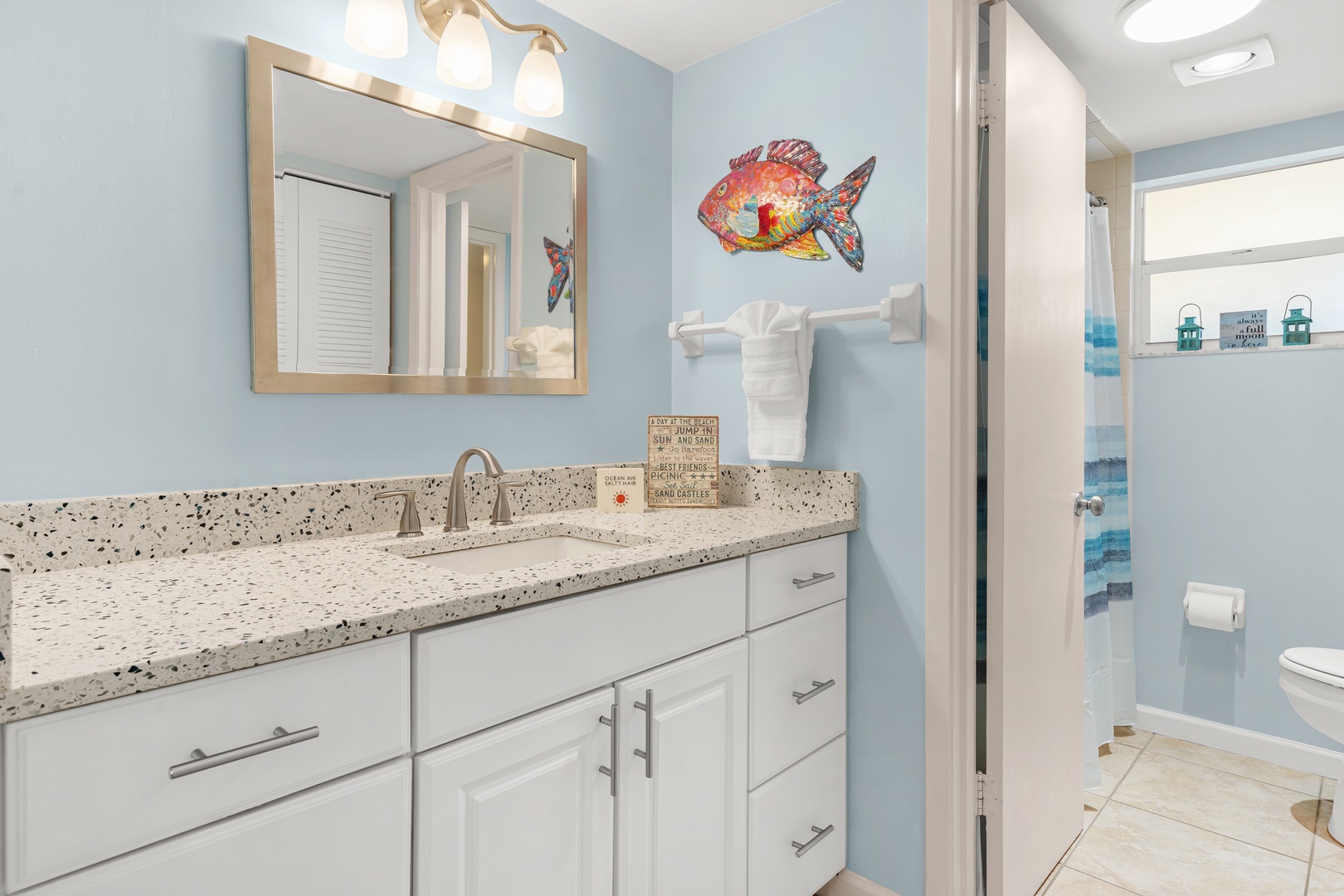 Ensuite bathroom with plenty of counter space and plush towels for your stay.