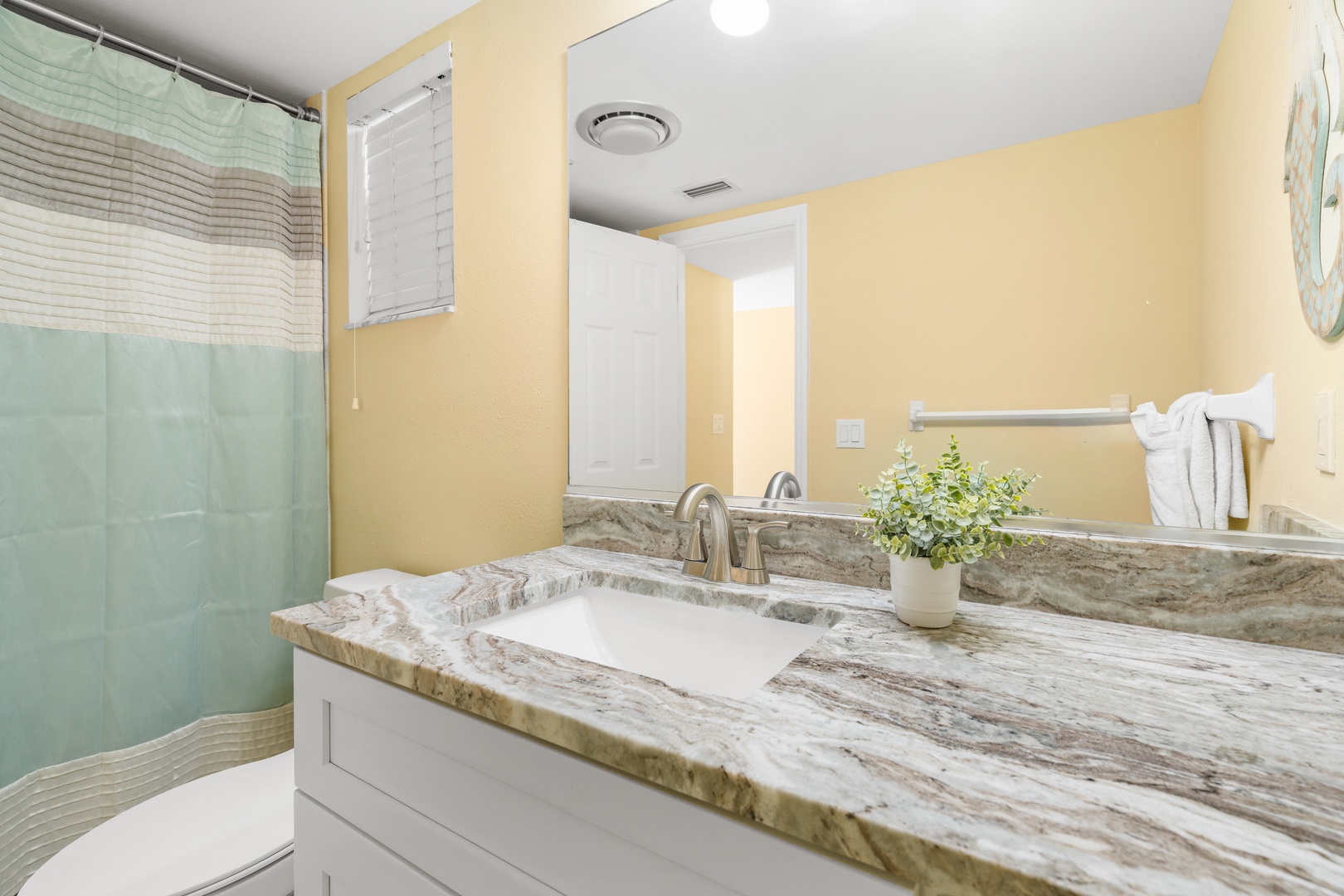 Your private bathroom features elegant marble countertops, fresh linens, and a relaxing shower for unwinding after your adventures.