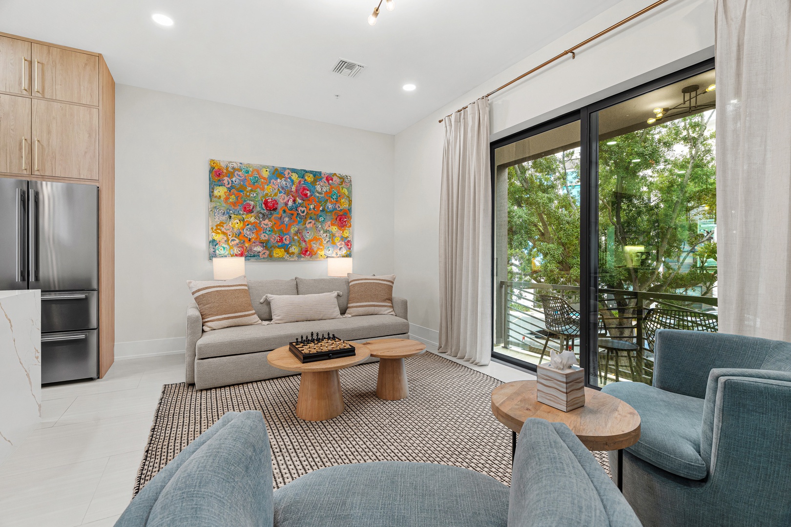 Settle into your bright living space with private balcony invites you to unwind outdoors.