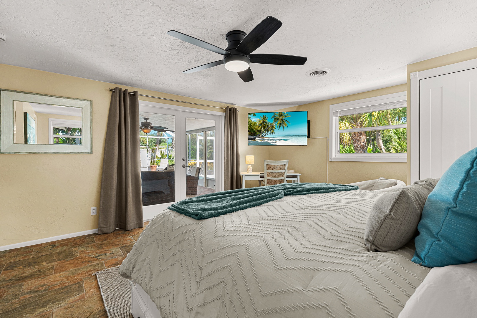 Wake up to palm trees swaying just beyond your window and doors that open onto your own outdoor retreat. The space is bright, airy, and designed to help you unwind.