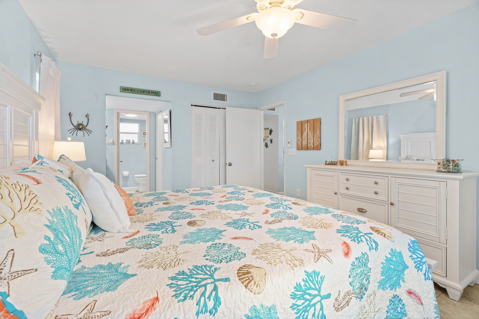 Primary bedroom featuring King bed, hotel-style linens, Smart TV with streaming services, and ensuite bathroom.