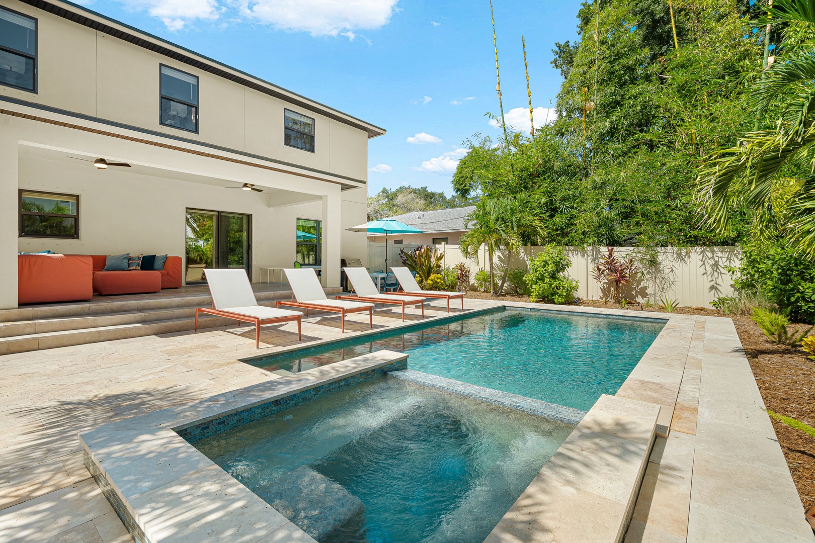 Soak up the Florida sunshine by your private pool and spa, surrounded by lush tropical landscaping. Lounge on the patio steps with your morning coffee or unwind on a sunbed after a day of exploring.
