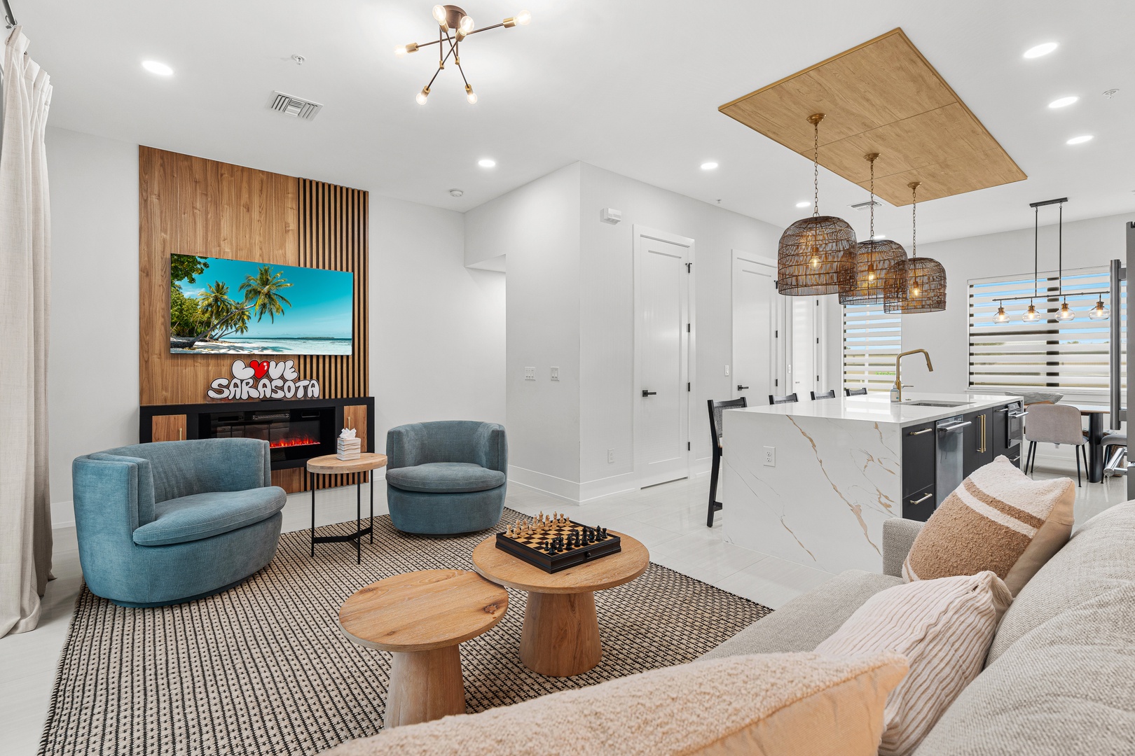 Step into your bright, contemporary retreat where coastal vibes meet modern comfort. Sink into plush seating, gather around natural wood accents, and enjoy the sleek open-plan kitchen perfect for preparing meals together.