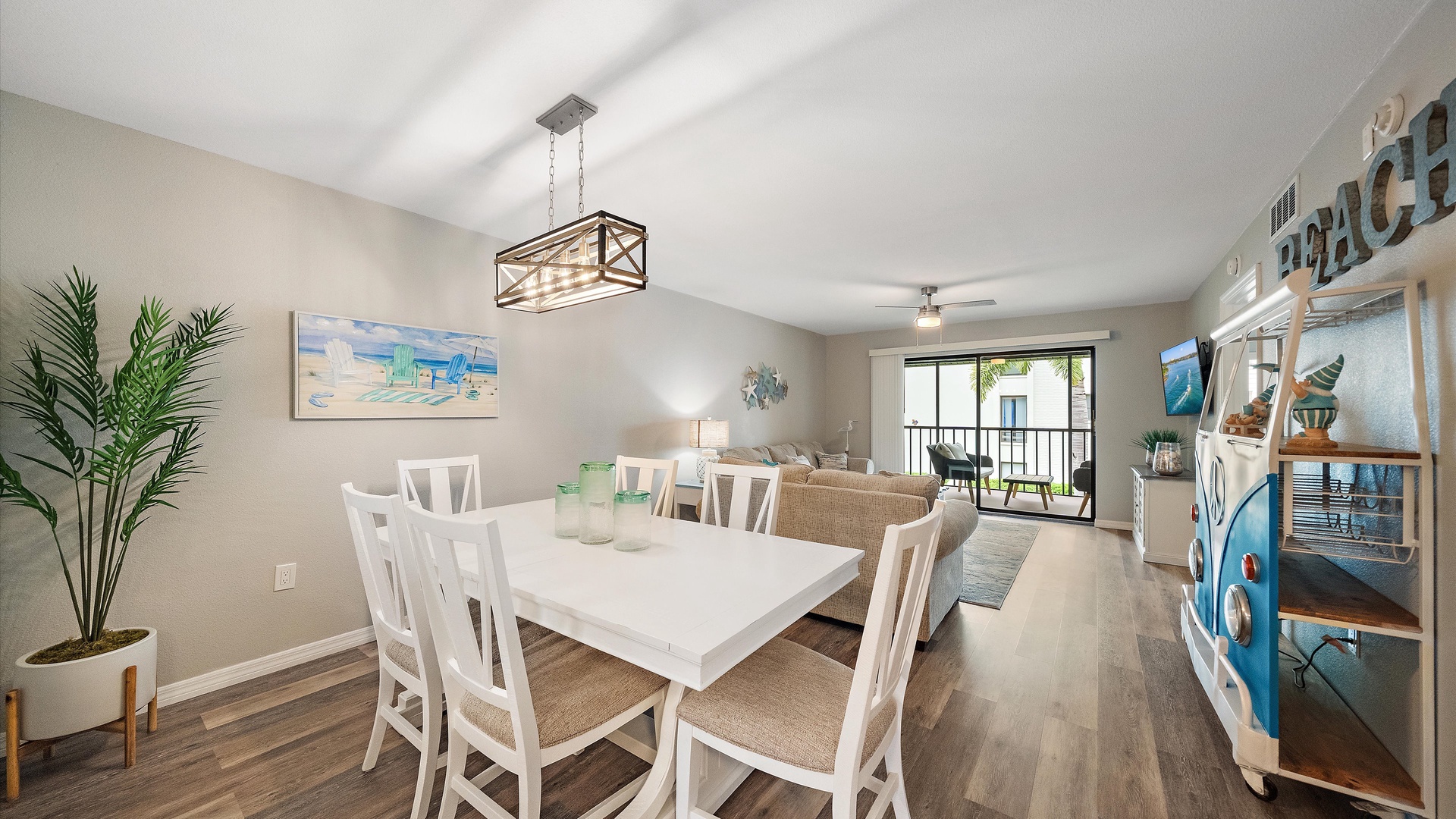 Step into your coastal retreat with an open dining and living area that flows effortlessly to your private balcony. Natural light fills the space, creating a bright, welcoming atmosphere perfect for relaxing after a day at the beach.