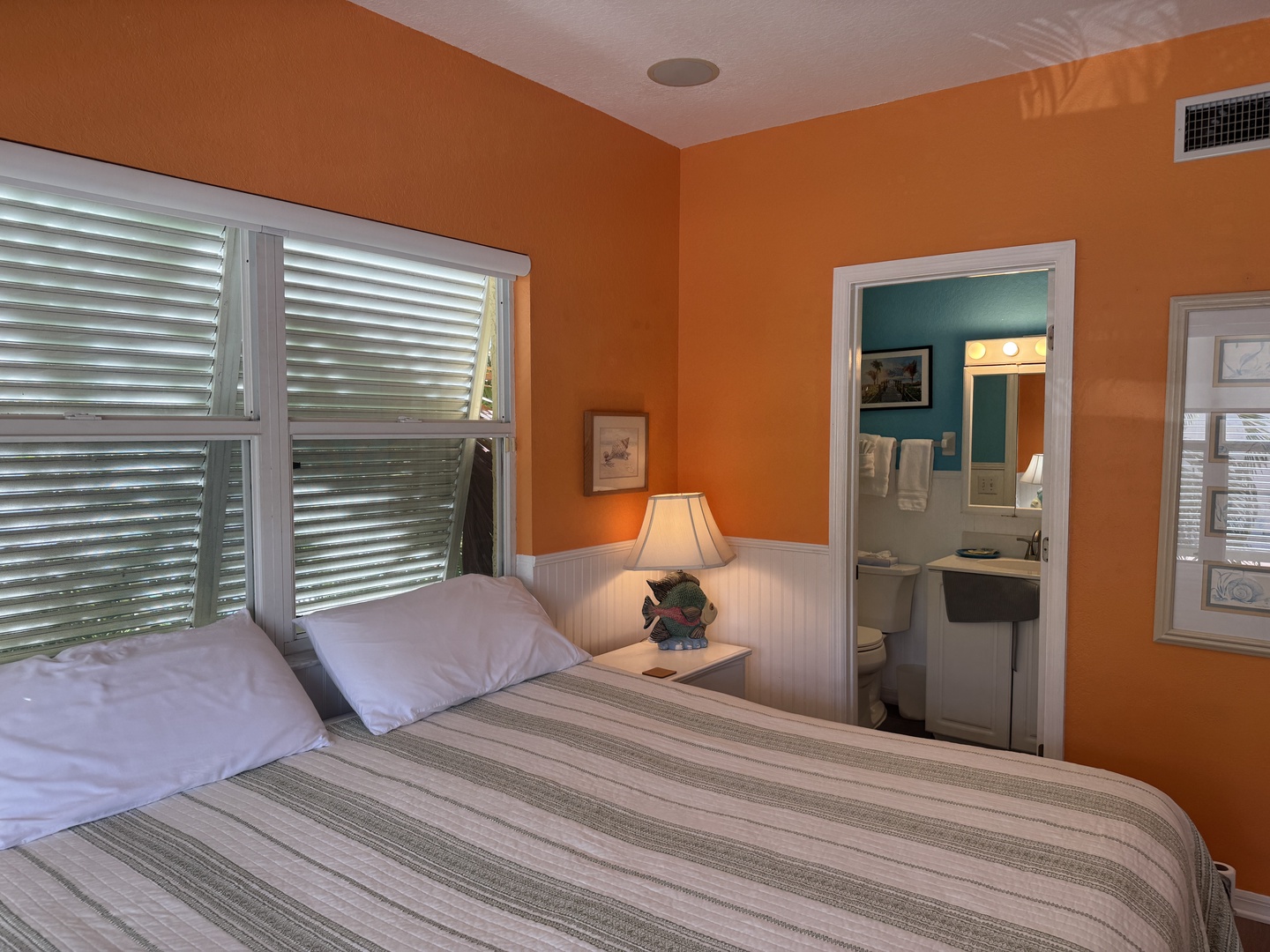 Drift into restful sleep in your bright, cheerfully painted room with fresh linens and a private ensuite bathroom just steps away.