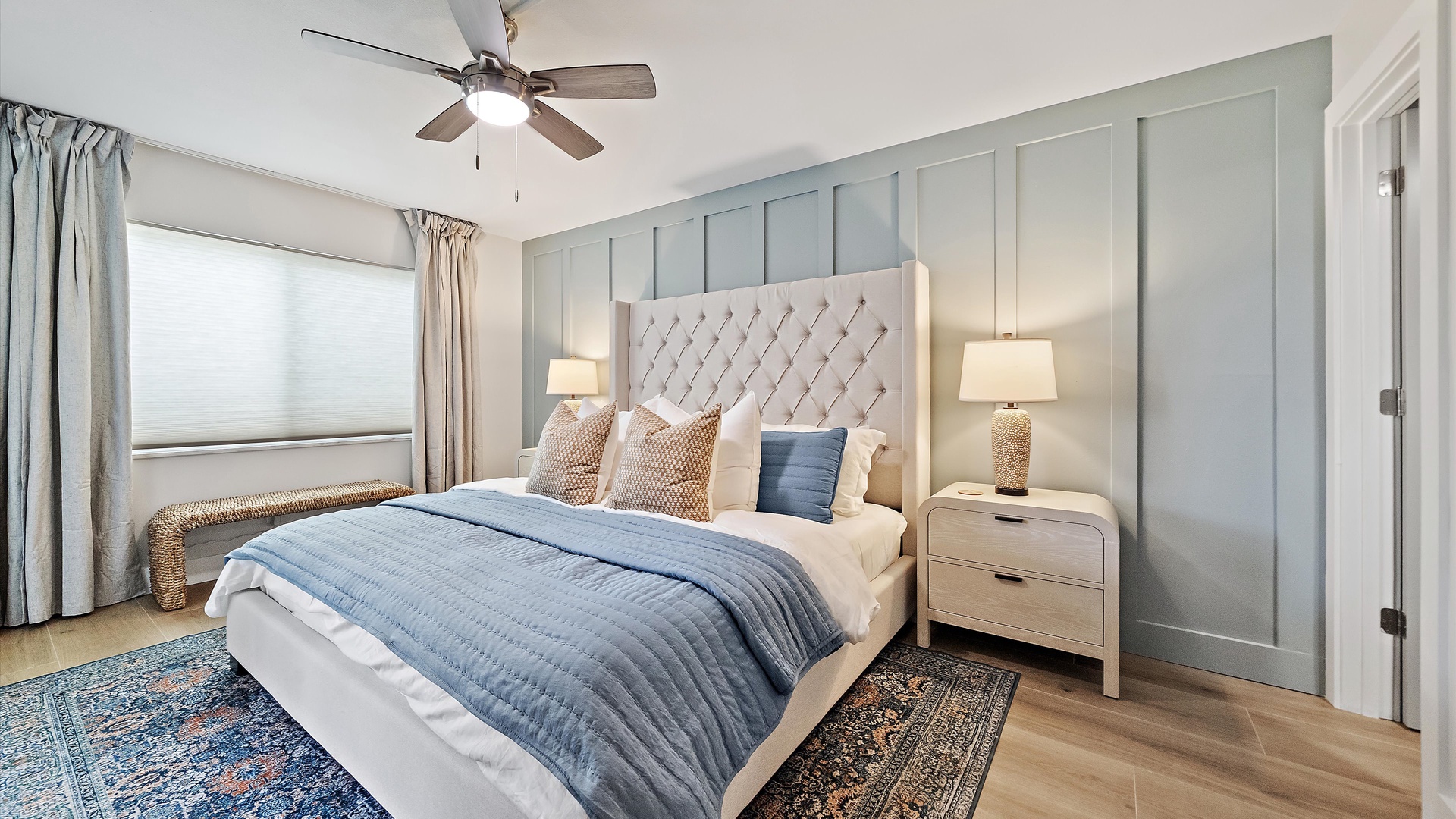 Sink into your cloud-soft bed surrounded by calming coastal blues and warm textures that invite deep, restful sleep.