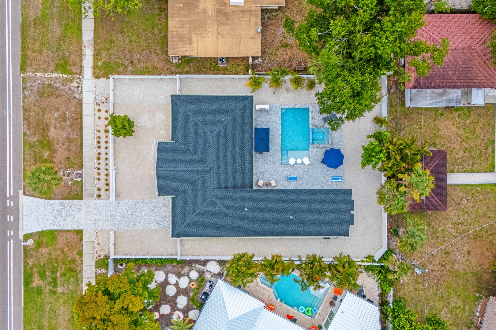 Aerial view of the home in a peaceful residential neighborhood.