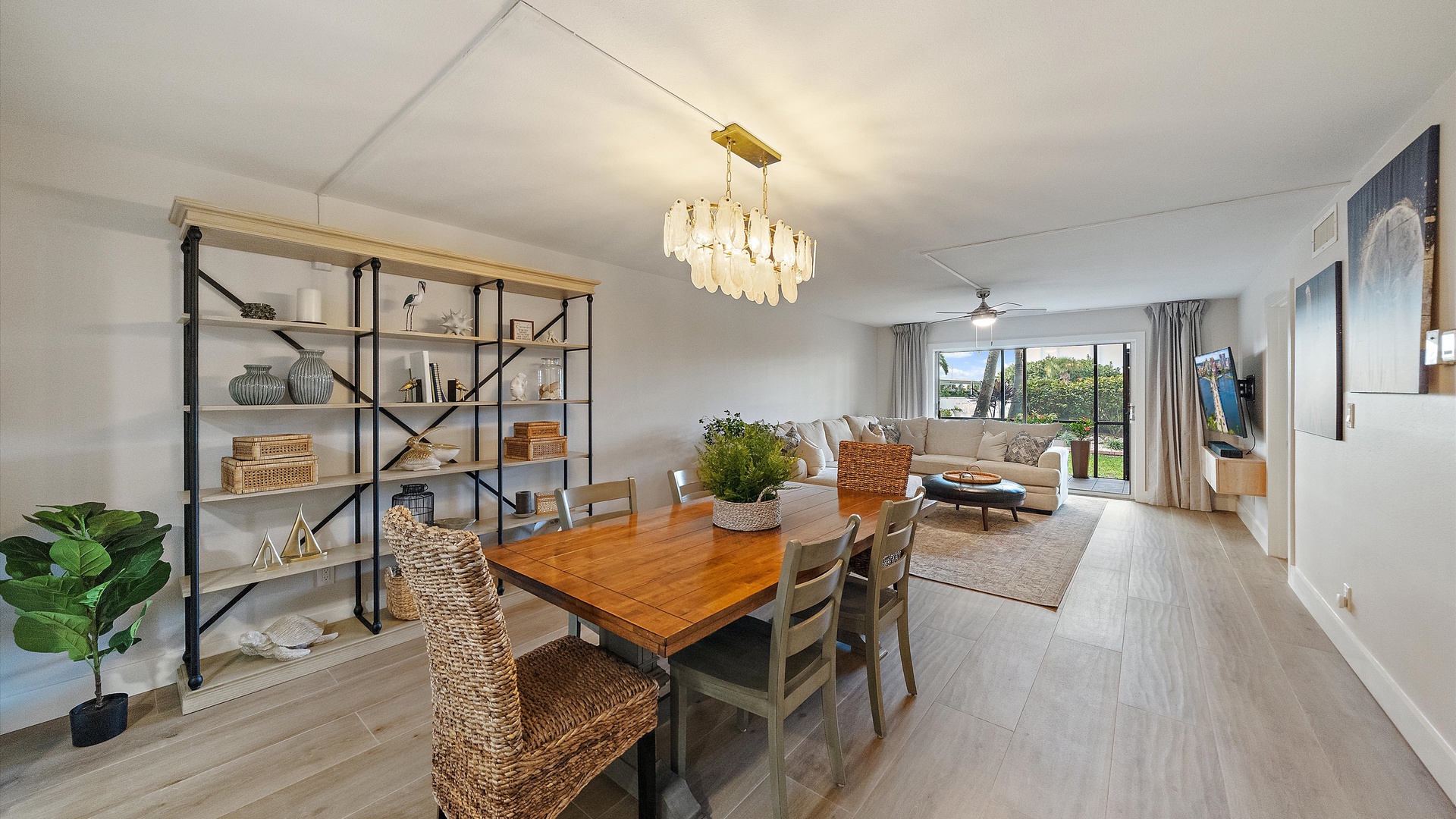 Your stylish open-concept living space features warm wood accents, modern lighting, and comfortable seating perfect for relaxing after exploring.