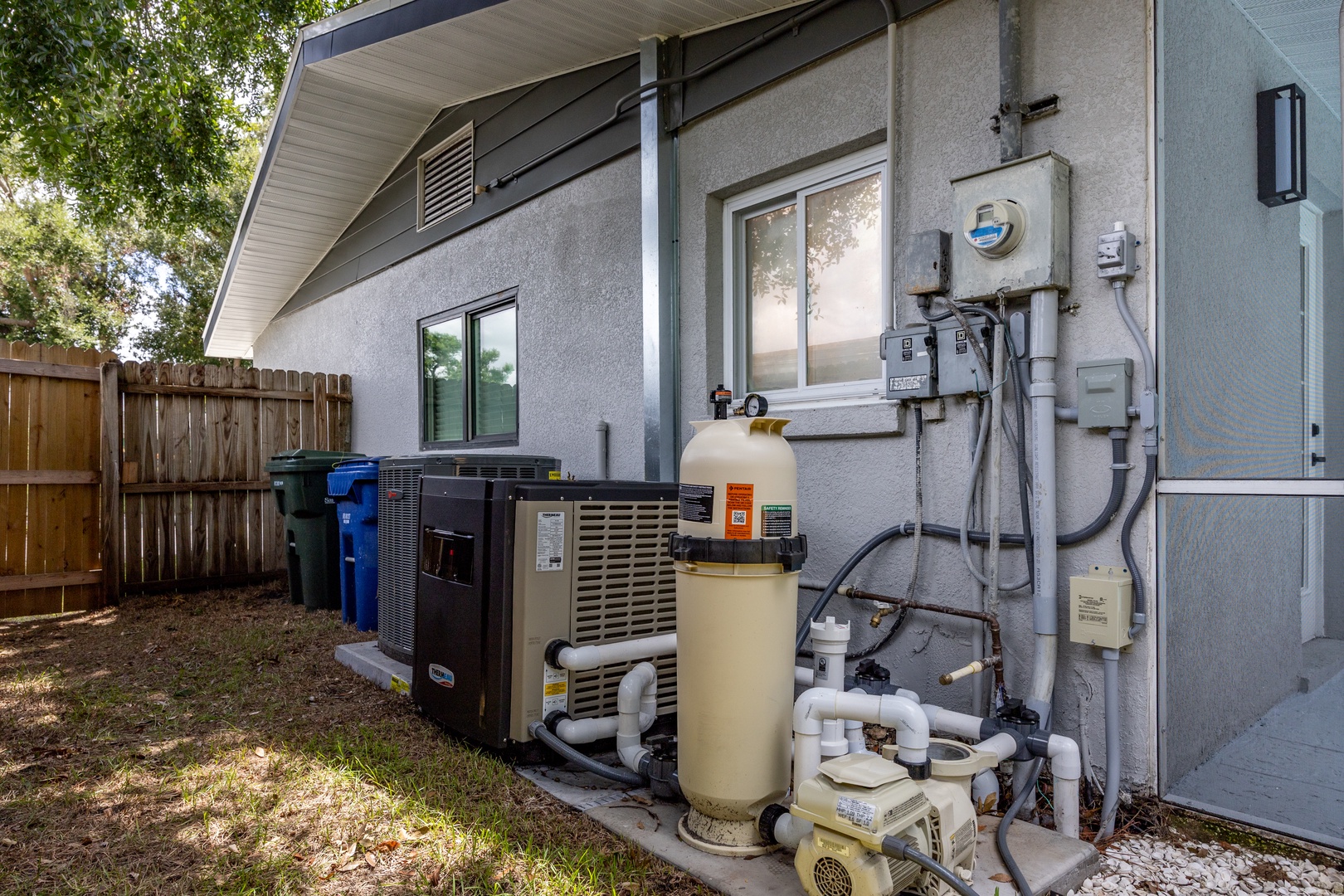 Modern property exterior featuring efficient HVAC and utility systems for your comfort and convenience.