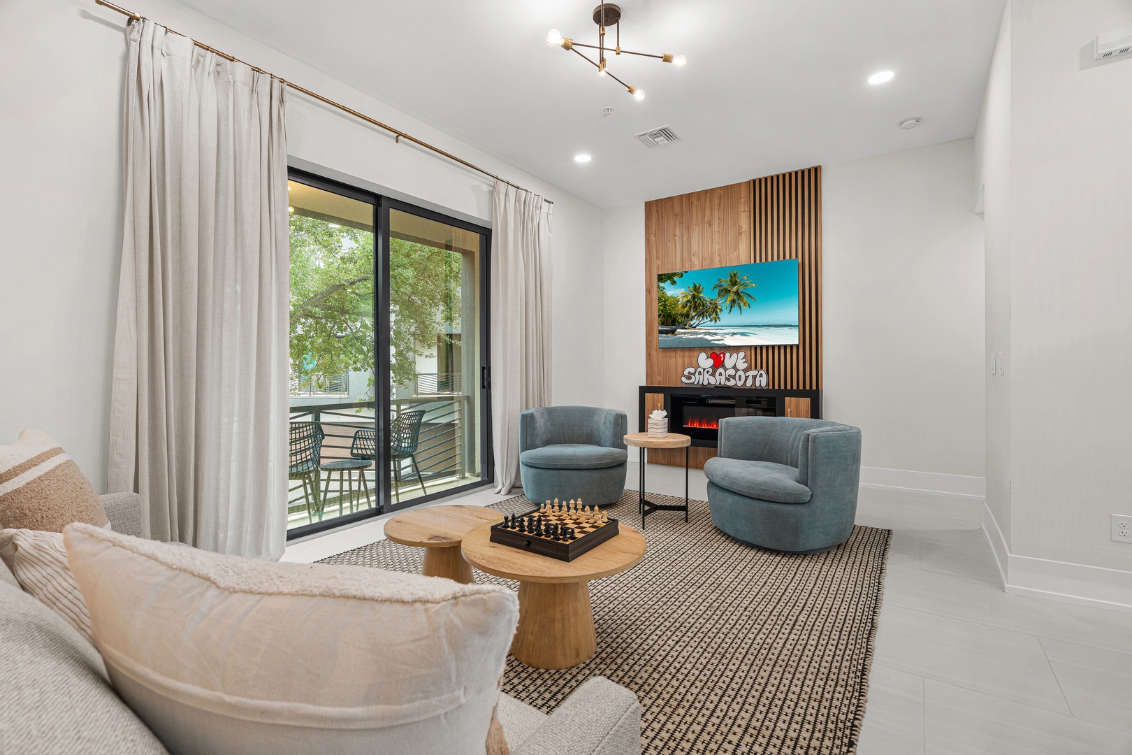 Step into your bright, stylish living space where comfort meets modern design. Sink into plush seating, enjoy the warmth of the fireplace, and slide open the glass doors to your private balcony, inviting the fresh air in.