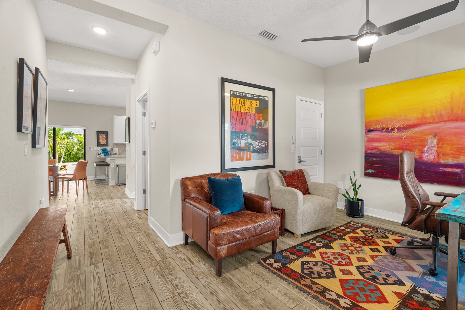 Settle into your stylish living area with modern furnishings and vibrant artwork. The open layout and natural light create a welcoming atmosphere where you can unwind after exploring.