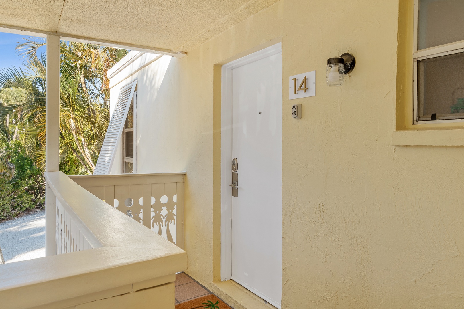 Exterior view of the second-floor Beach Castle condo. Laundry room available just below the unit.