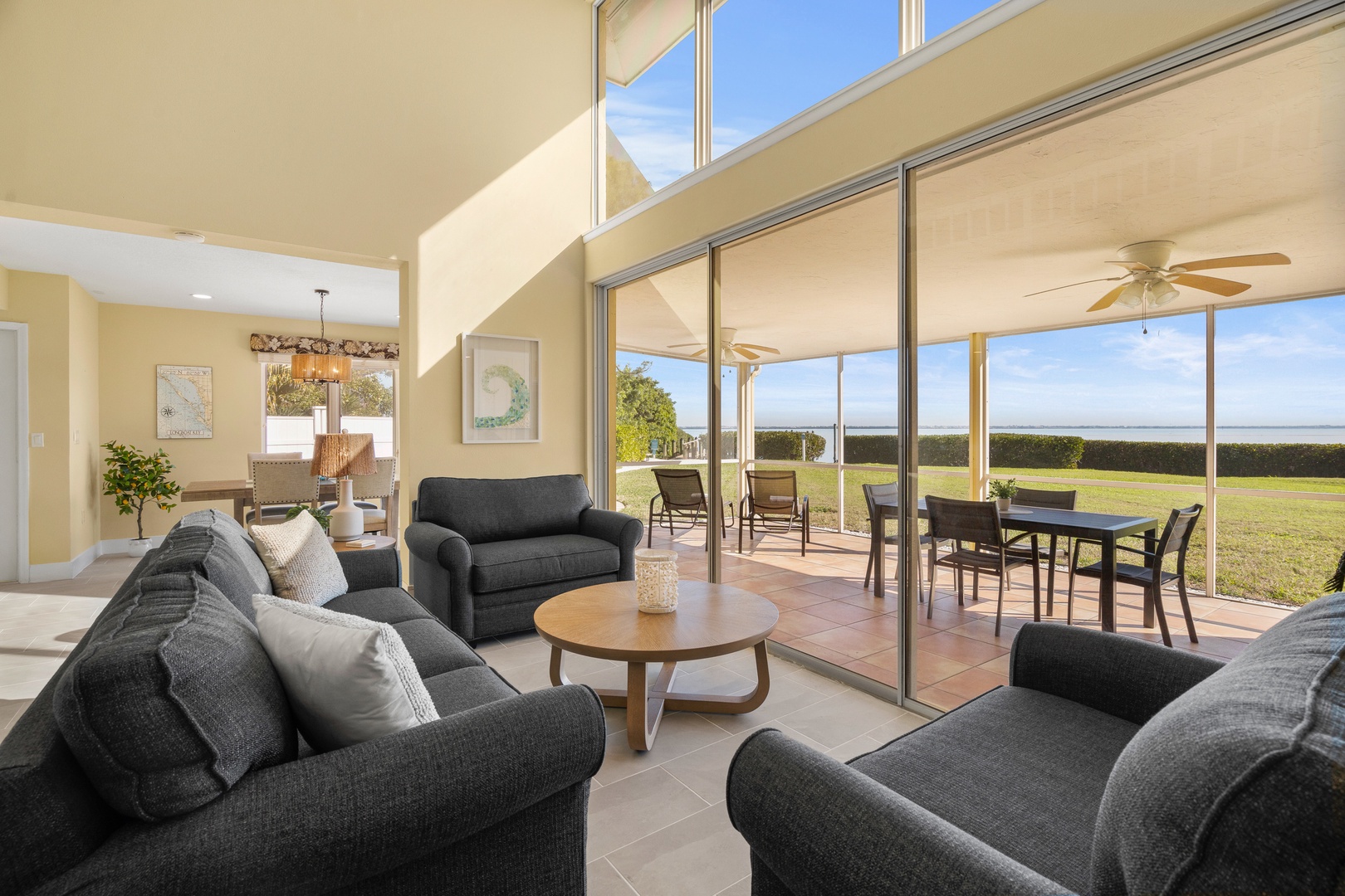 Relax in this bright living space where floor-to-ceiling windows frame expansive countryside views, perfect for unwinding after your adventures.