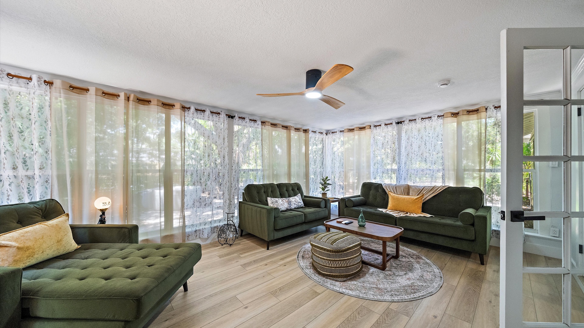 Unwind in your bright, airy living room where plush seating and natural light create the perfect retreat. Curl up with a book or gather with loved ones in this tranquil space.