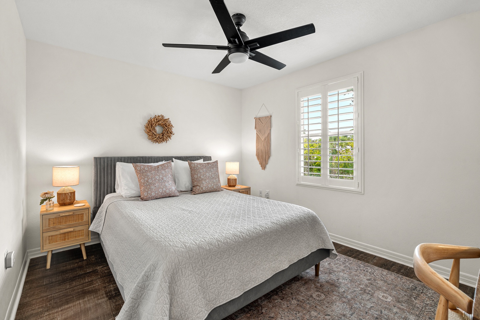 Your peaceful retreat features a plush bed with soft linens, warm lighting, and a ceiling fan to keep you comfortable all night long.