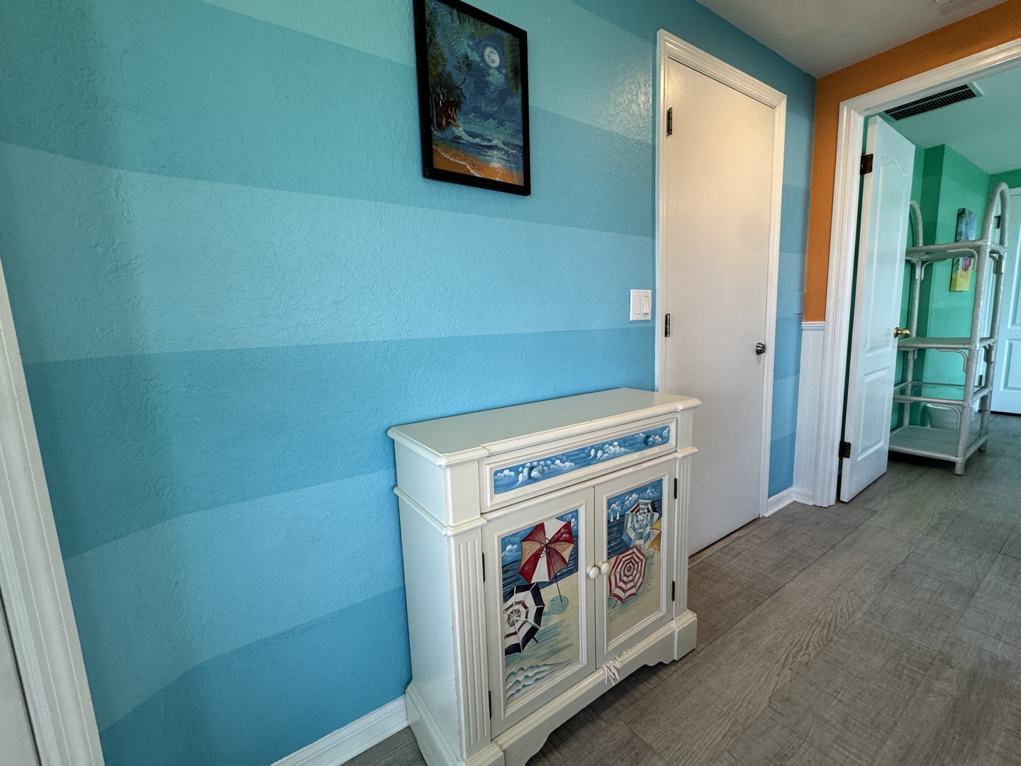 Step into your coastal retreat with cheerful turquoise walls and charming beach-themed accents welcoming you from the moment you arrive.