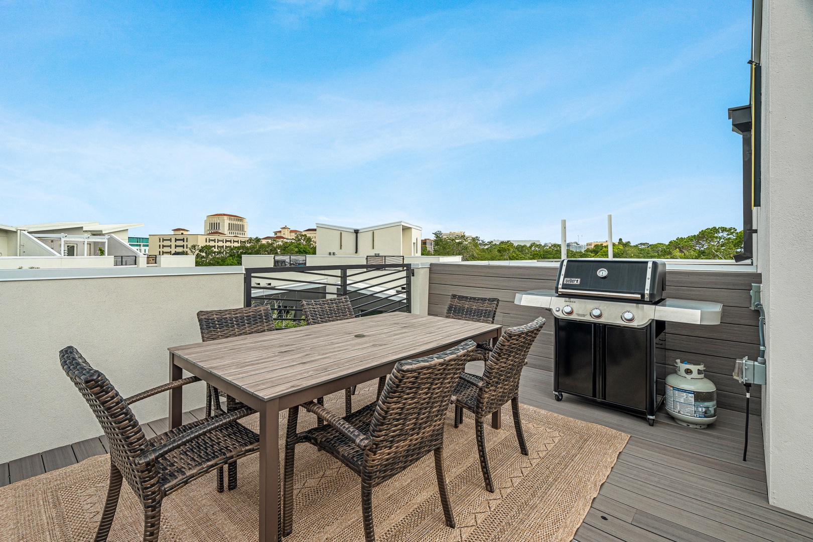Fire up the grill and gather around your private rooftop terrace, where open skies and neighborhood views set the scene for effortless outdoor dining.