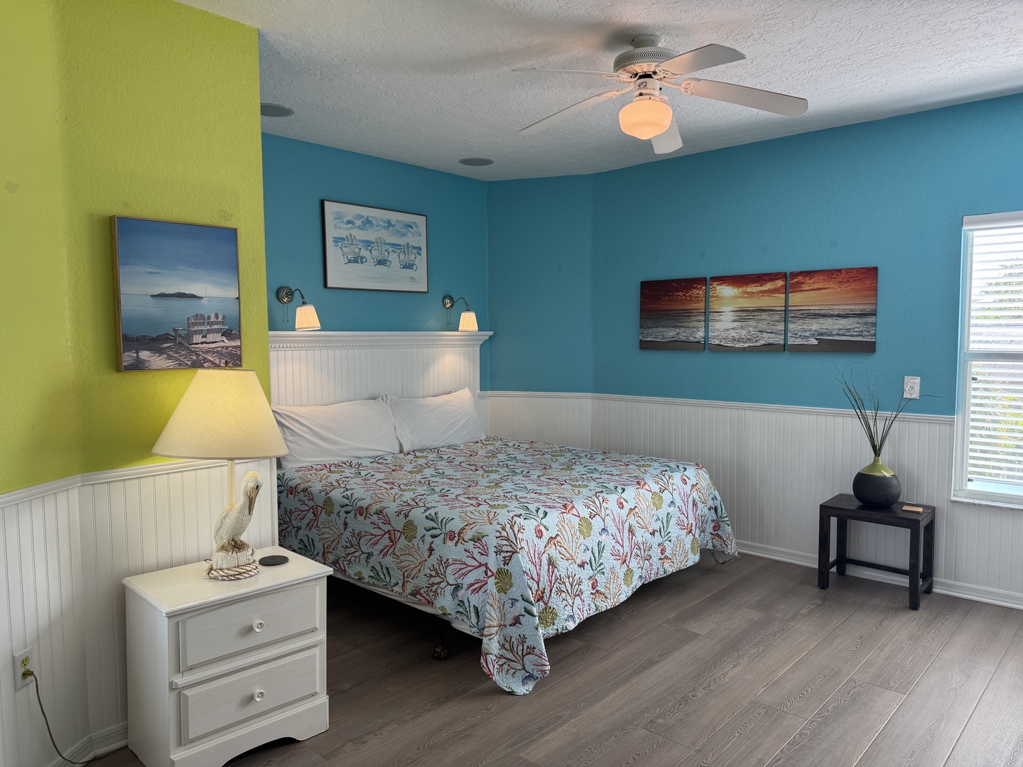 Sink into the soft bed and let the cool ceiling fan and cheerful coastal colors lull you into vacation mode.