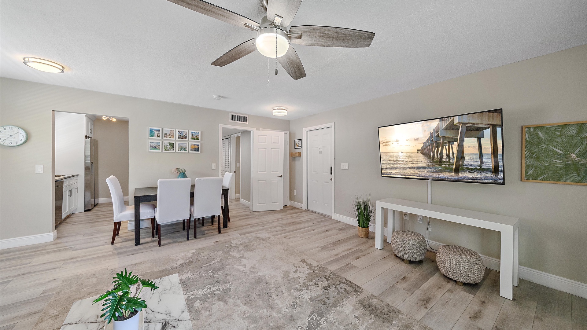 Relax in your bright, coastal-inspired living space with ceiling fan, modern finishes, and a welcoming vibe that blends indoor comfort with beach charm.
