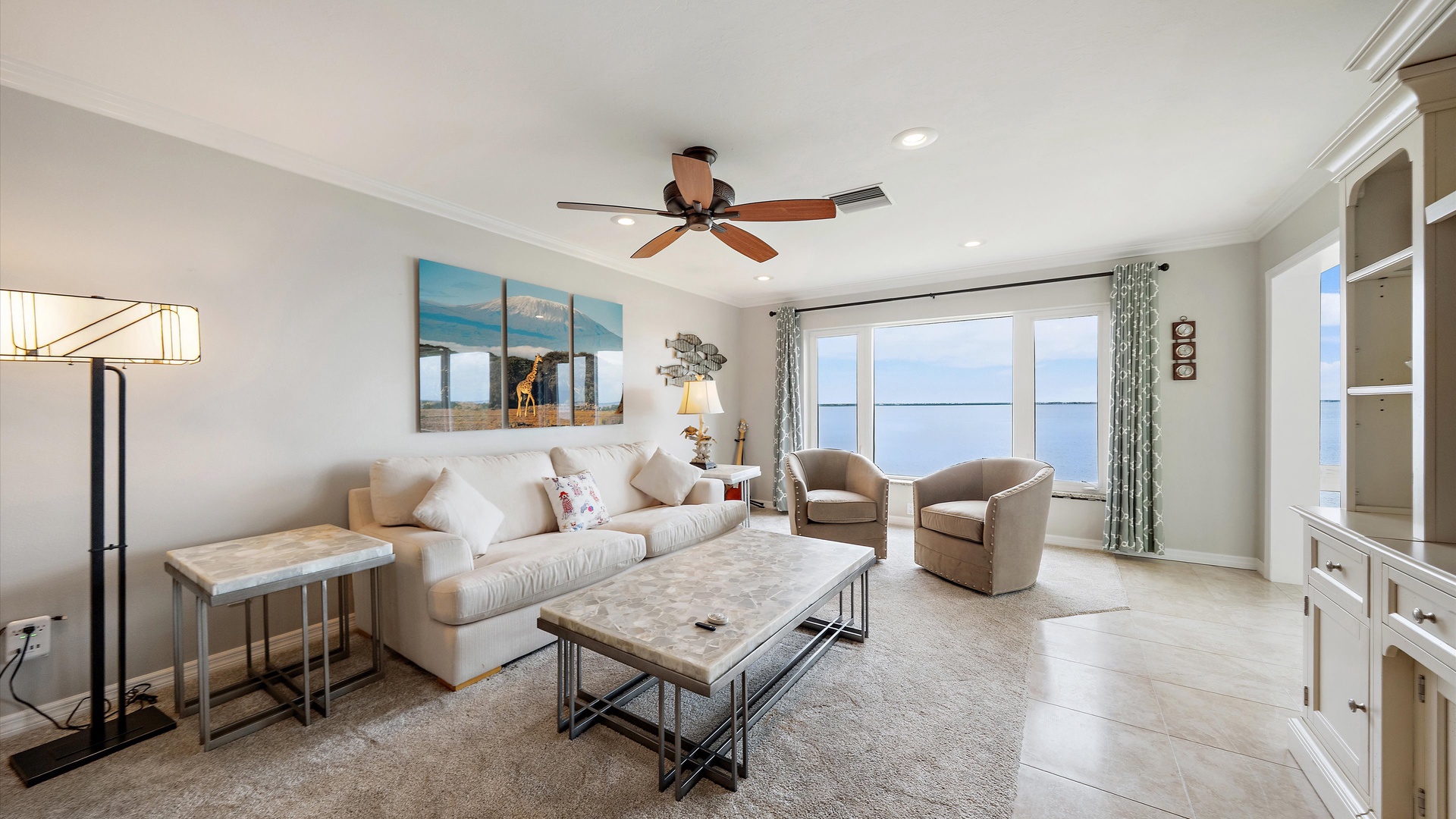 Come home to soft seating, sunlit interiors, and water views that stay with you throughout the living space. From an afternoon with a good book to a quiet evening together, this penthouse makes staying in feel like part of the vacation.