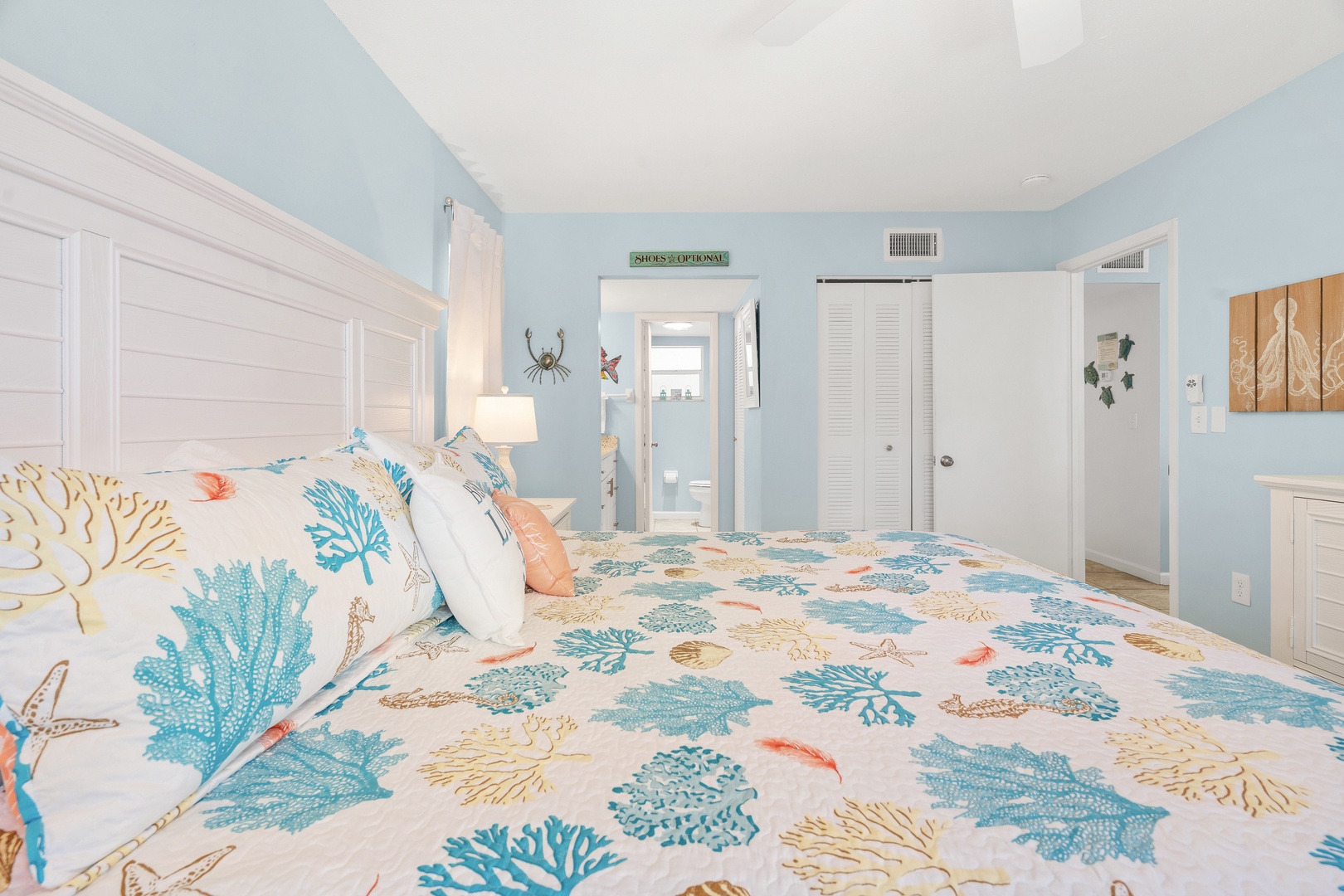 Primary bedroom featuring King bed, hotel-style linens, Smart TV with streaming services, and ensuite bathroom.