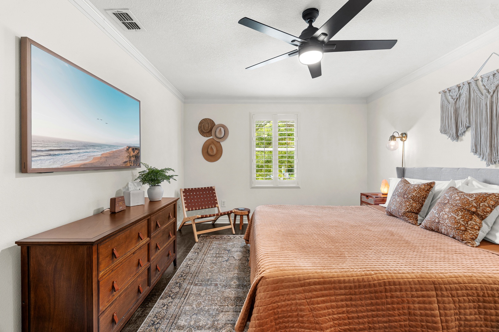 Sink into the plush bedding and coastal vibes of your private retreat, where ocean-inspired art and warm textures invite complete relaxation after a day of adventure.