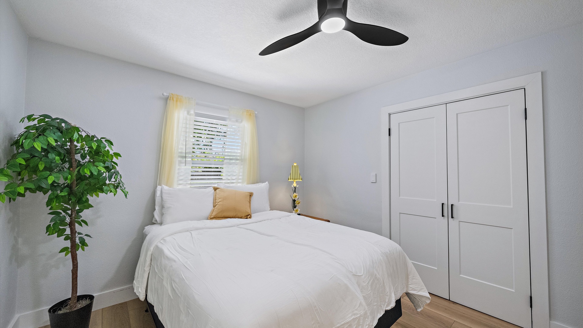 Slip into crisp linens and let the gentle ceiling fan lull you to sleep. Your peaceful retreat features a cozy bed, warm natural light, and thoughtful touches that make unwinding effortless.